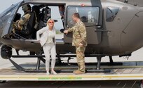 Austrian Defence Minister Klaudia Tanner disembarks a Vermont Army National Guard UH-72 Lakota helicopter for a tour of the Army Aviation Support Facility in South Burlington, Vermont, on May 12, 2022. The Vermont National Guard and Austrian Defence Ministry signed a State Partnership Program agreement May 11, 2022, to strengthen interagency cooperation and mutually improve in cyber defense, information operations, military mountaineering, humanitarian and disaster assistance response, and other areas. (U.S. Army National Guard photo by Don Branum)