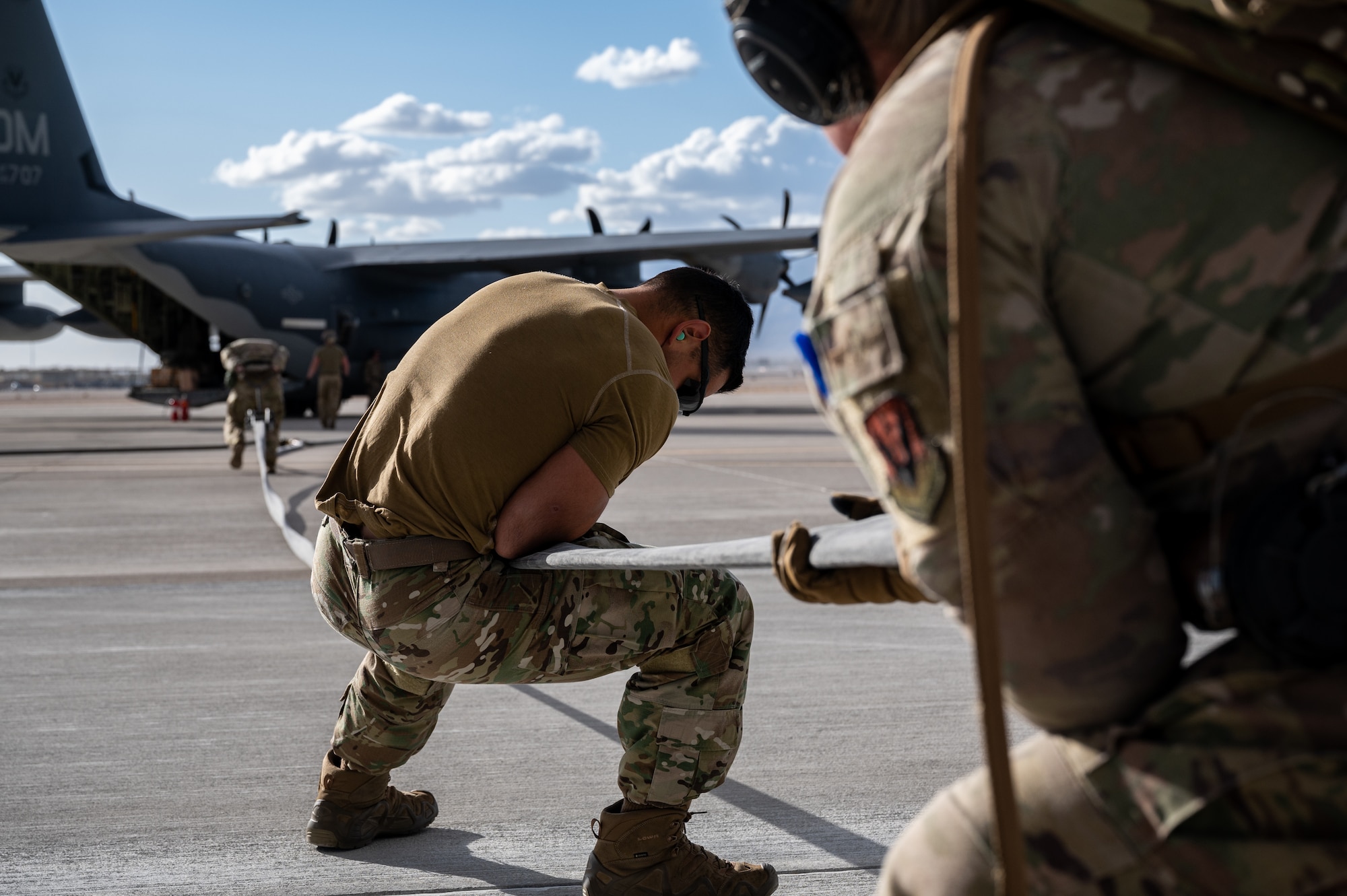 Airmen assigned to the 355th Logistics Readiness Squadron's Petroleum, Oil and Lubricants section, Davis-Monthan Air Force Base, Arizona, pack up the equipment used in Forward Area Refueling Point (FARP) training during Black Flag 22-1 at Nellis Air Force Base, Nevada, May 11, 2022. As part of Agile Combat Employment, FARP training prepares Airmen to effectively refuel aircraft in austere locations when air-to-air refueling is not possible or when fueling stations are not accessible. (U.S. Air Force photo by Airman 1st Class Josey Blades)