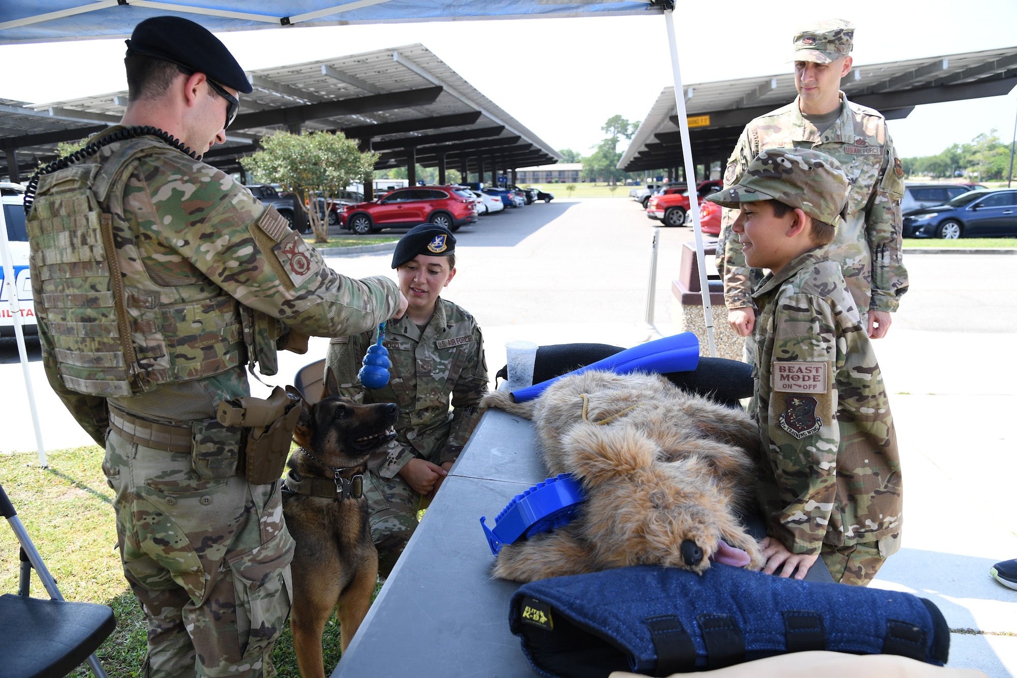 Members of the 81st Security Forces Squadron provide a military working dog demonstration during Police Week defender demo day at Keesler Air Force Base, Mississippi, May 18, 2022. The event was held during National Police Week, recognizing the men and women in law enforcement. (U.S. Air Force photo by Kemberly Groue)