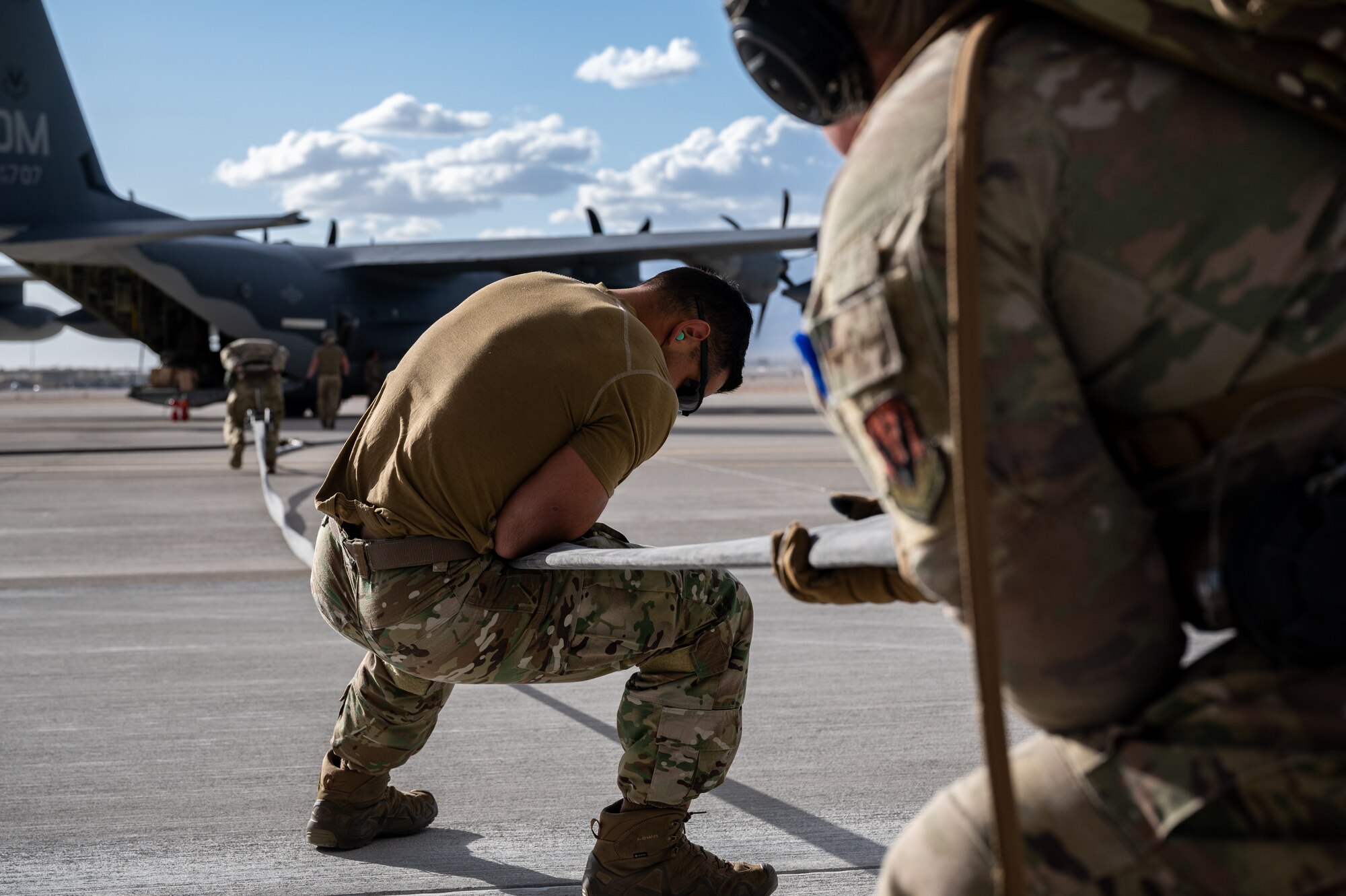 Airmen assigned to the 355th Logistics Readiness Squadron's Petroleum, Oil and Lubricants section, Davis-Monthan Air Force Base, Arizona, pack up the equipment used in Forward Area Refueling Point (FARP) training during Black Flag 22-1 at Nellis Air Force Base, Nevada, May 11, 2022. As part of Agile Combat Employment, FARP training prepares Airmen to effectively refuel aircraft in austere locations when air-to-air refueling is not possible or when fueling stations are not accessible. (U.S. Air Force photo by Airman 1st Class Josey Blades)