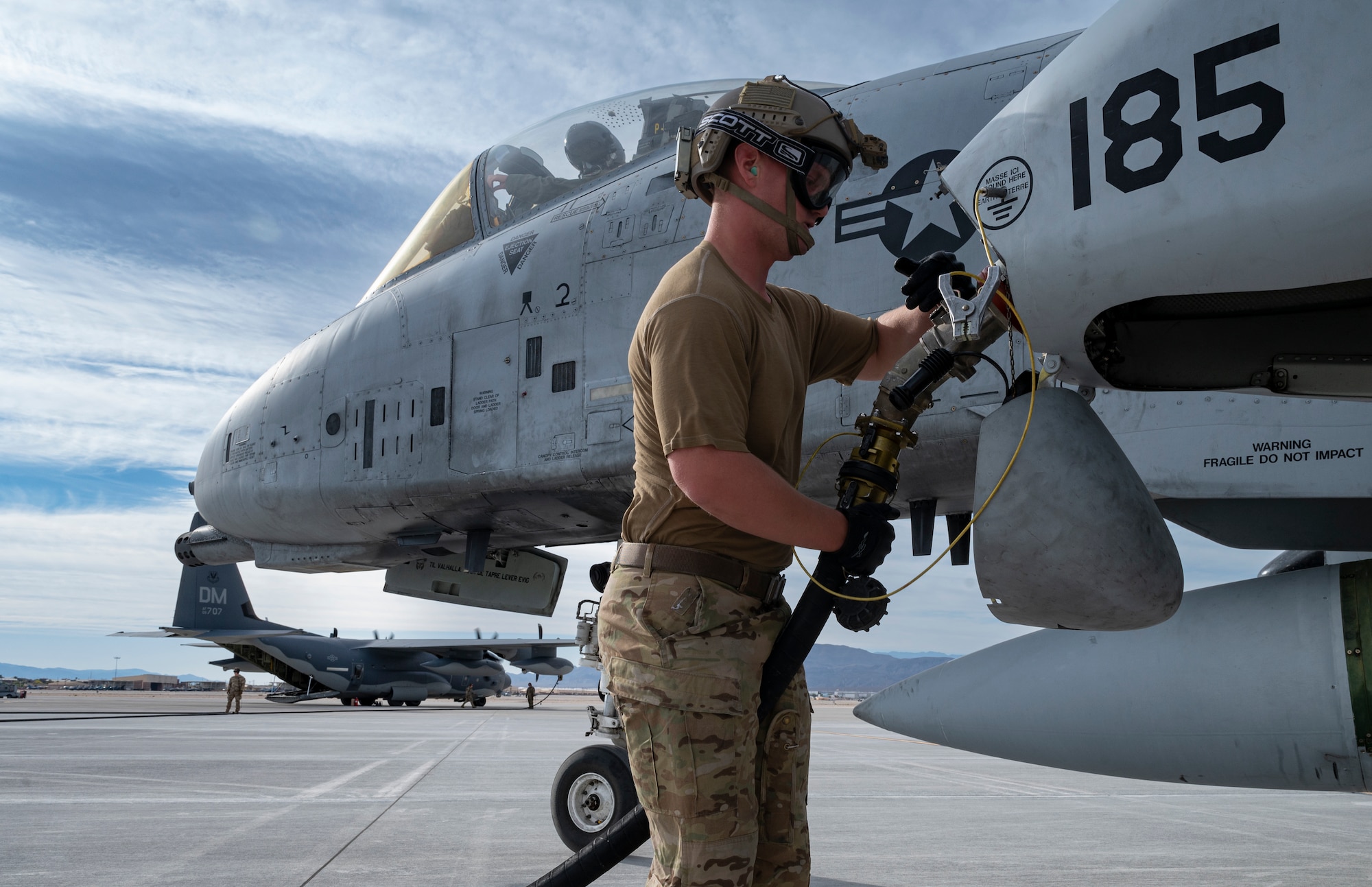 U.S. Air Force Staff Sgt. Daniel Watford, Forward Area Refueling Point (FARP) Operator assigned to the 355th Logistics Readiness Squadron, Davis-Monthan Air Force Base, Arizona, fuels up an A-10C Thunderbolt II during Black Flag 22-1 at Nellis AFB, May 10, 2022. Black Flag is focused on developing and validating large force tactics and integration required to deliver combat capability and tactical advantage for the Combat Air Force to build readiness that credibly deters and successfully defeats adversaries. (U.S. Air Force photo by William R. Lewis)
