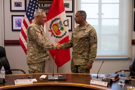 Lt. Gen. David Ojeda Parra Peruvian Army chief of staff, left, and Maj. Gen. William L. Thigpen, U.S. Army South commanding general, shake hands during the 7th annual U.S.-Peru Army Staff Talks May 18 at U.S. Army South headquarters, Fort Sam Houston, Texas.