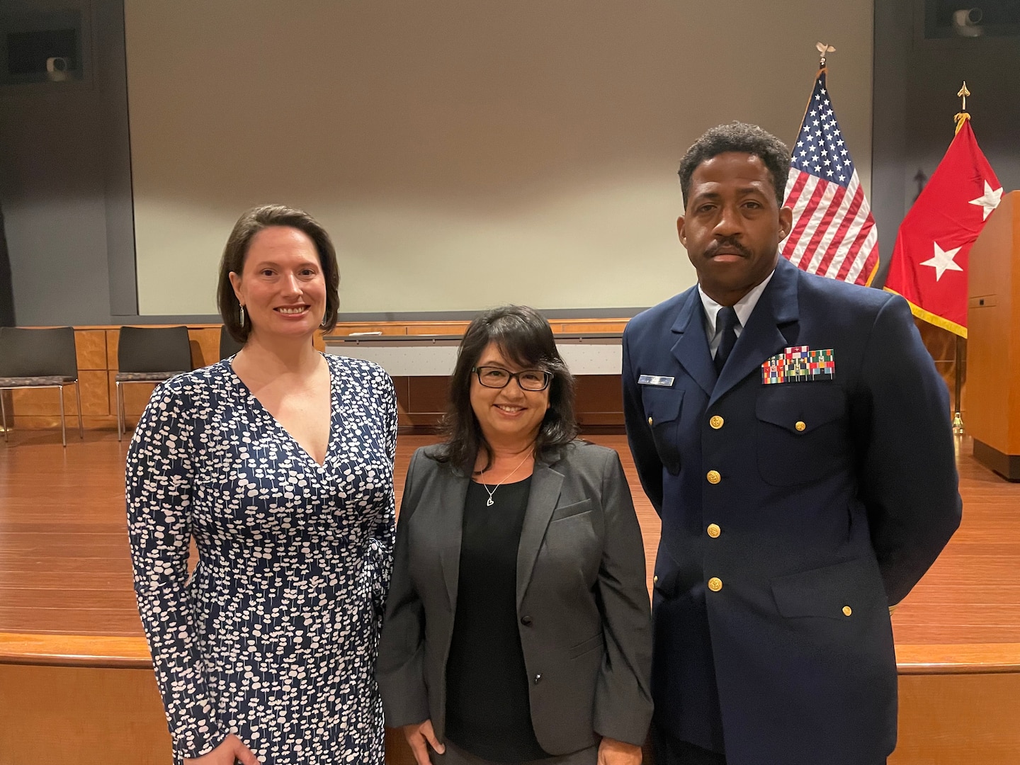 Lianne Casupang, District 14’s Sexual Assault Response Coordinator and the Coast Guard’s SARC of the Year for 2022, is recognized during a ceremony at the Mark Center in Washington, D.C, May 17, 2022. Pictured from left to right: Lindsay Charles, Coast Guard SAPRR Oversight & Policy Office Chief, Lianne Casupang, and Cmdr. Michael Wolfe, Coast Guard Liaison to the Department of Defense Sexual Assault Prevention and Response Office. (U.S. Coast Guard photo.)
