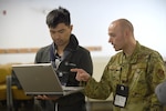 U.S. Air Force Tech. Sgt. Ezekiel Wieland, 272nd Cyber Operations Squadron, 110th Wing, Michigan Air National Guard, participates in a cyber-warfare training event, Camp Grayling Joint Maneuver Training Center, Michigan, March 8, 2022.