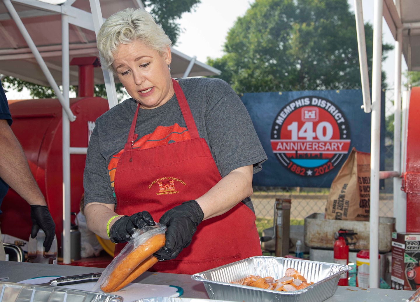 Recognized by USAToday as the “Most Prestigious Barbecue Contest,” the four-day Memphis in May World Championship Barbecue Cooking Contest (WCBCC) took place from May 12th through the 14th this year. The Memphis District has been competing in this barbeque contest for years, with the Castle Cookers first participating in the WCBCC in 1991 as the Pork Barrel Barbecuers. This year made year 31, with the team for the Memphis District Corps of Engineers comprising of workers from all parts of the district. Memphis District Castle Cookers this year were: Program Analysis Officer Jennifer Thomas, Program Analyst Sara Waterbury, Program Analyst David Alverez, Outreach Coordinator Brian Schneider (Tomato Sauce and Poultry entries), Work for Others Technical Manager Jordan Bledsoe, Civil Engineer Morgan Cowles (Seafood entry), and Survey Boat Operator Brian Schafer (Crawfish).
