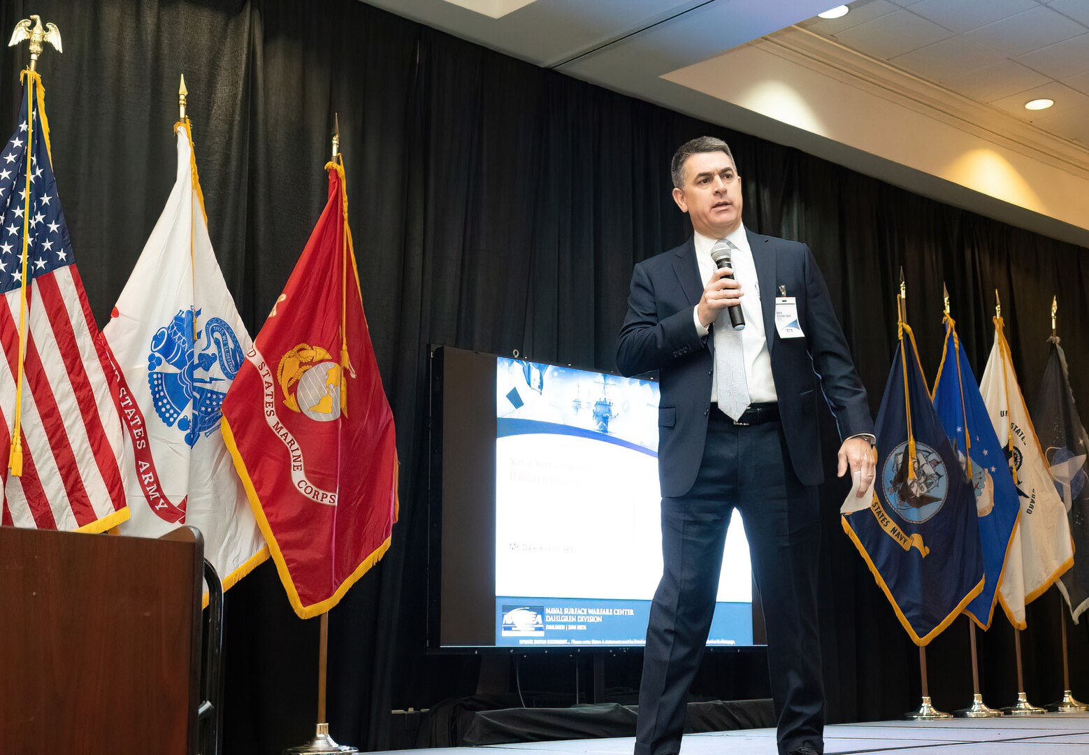 IMAGE: Naval Surface Warfare Center Dahlgren Division (NSWCDD) Technical Director, Dale Sisson, SES, delivers his remarks on the warfare center division’s strategic overview during the 2022 NSWCDD Outreach and Industry Day, May 18.