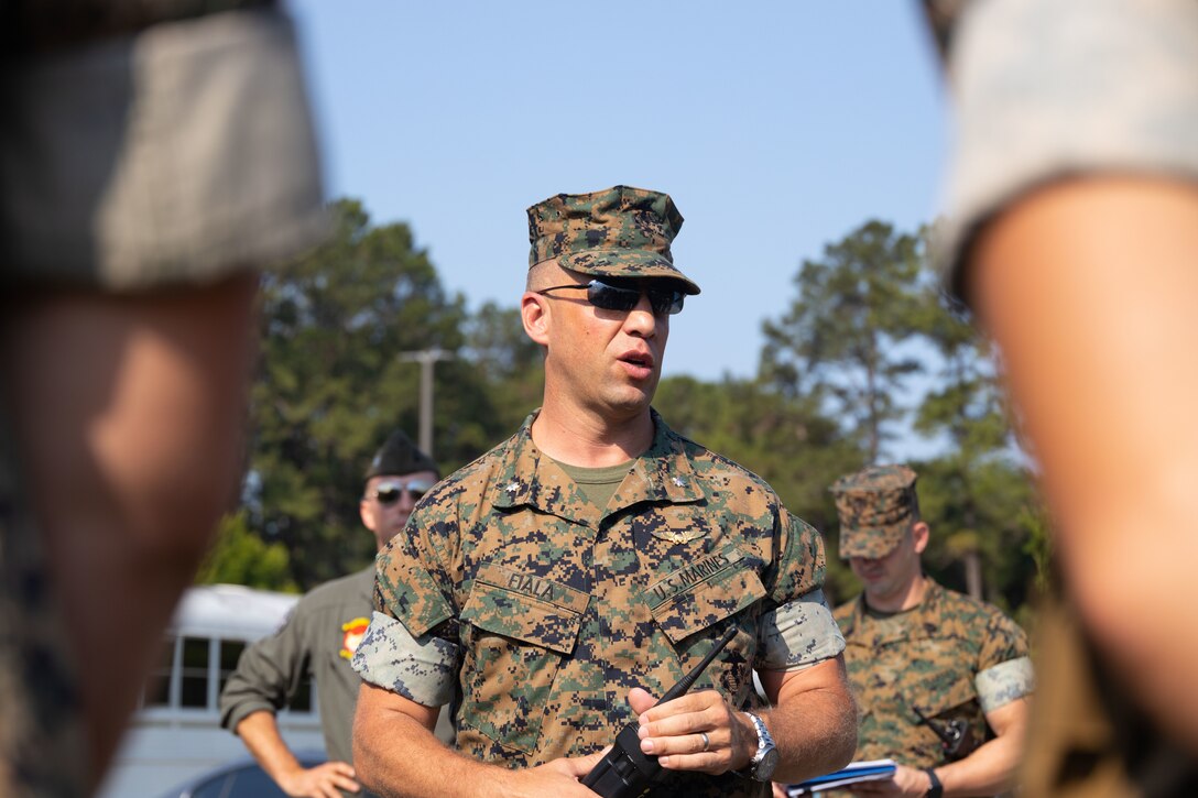 U.S. Marine Corps Lt. Col. Benjamin Fiala, commanding officer, Headquarter and Headquarters Squadron, Marine Corps Air Station (MCAS) Beaufort, gives a debrief during Exercise STRATMOBEX on MCAS Beaufort, May 19, 2022. STRATMOBEX allowed key personnel to practice their role in evacuating and manning the air station in cases of extreme weather. (U.S. Marine Corps photo by Sgt. Cheyeanne Campbell)