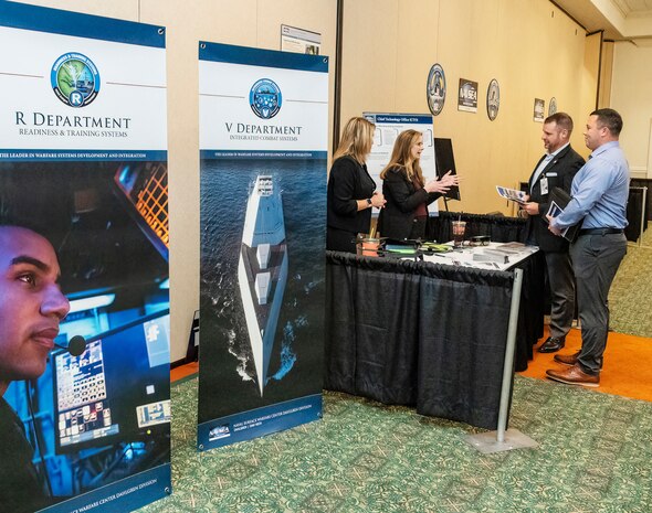 IMAGE: Naval Surface Warfare Center Dahlgren Division (NSWCDD) Chief Technology Officer Jennifer Clift (second from left) talks with attendees at the 2022 NSWCDD Outreach and Industry Day, May 18. The event provided an opportunity to share a wide array of opportunities to area small and large business industry partners who are hoping to team with NSWCDD on future endeavors.