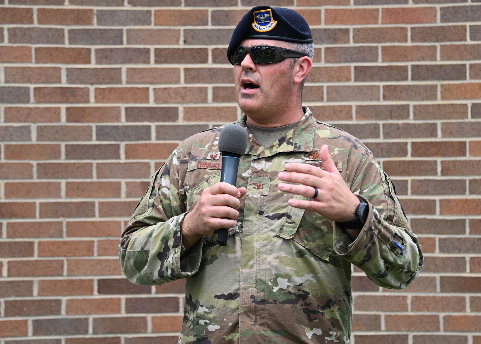 Col. Ian Dinesen, 316th Security Forces Group commander, delivers closing remarks at the end of National Police Week near the Tactical Fitness Center at Joint Base Andrews, Md., May 20, 2022. Throughout the week, military personnel participated in events including a 24-hour vigil, a 5k Memorial Ruck, video game tournaments and an Excellence in Competition shooting competition. (U.S. Air Force photo by Airman 1st Class Isabelle Churchill)