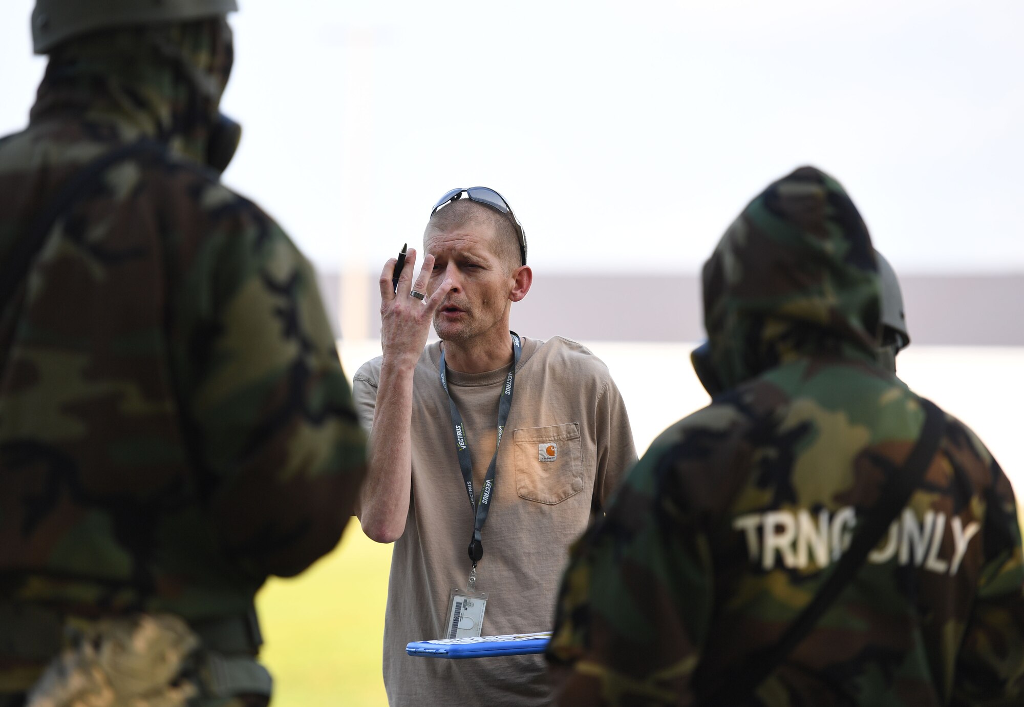 Chris Butler, Base Operations Support emergency management technician, provides an overview for identifying levels of contamination during a small scale readiness assessment at Keesler Air Force Base, Mississippi, May 18, 2022. The assessment allowed Keesler personnel to be evaluated on their basic life saving skills in preparation of real-world events. (U.S. Air Force photo by Kemberly Groue)