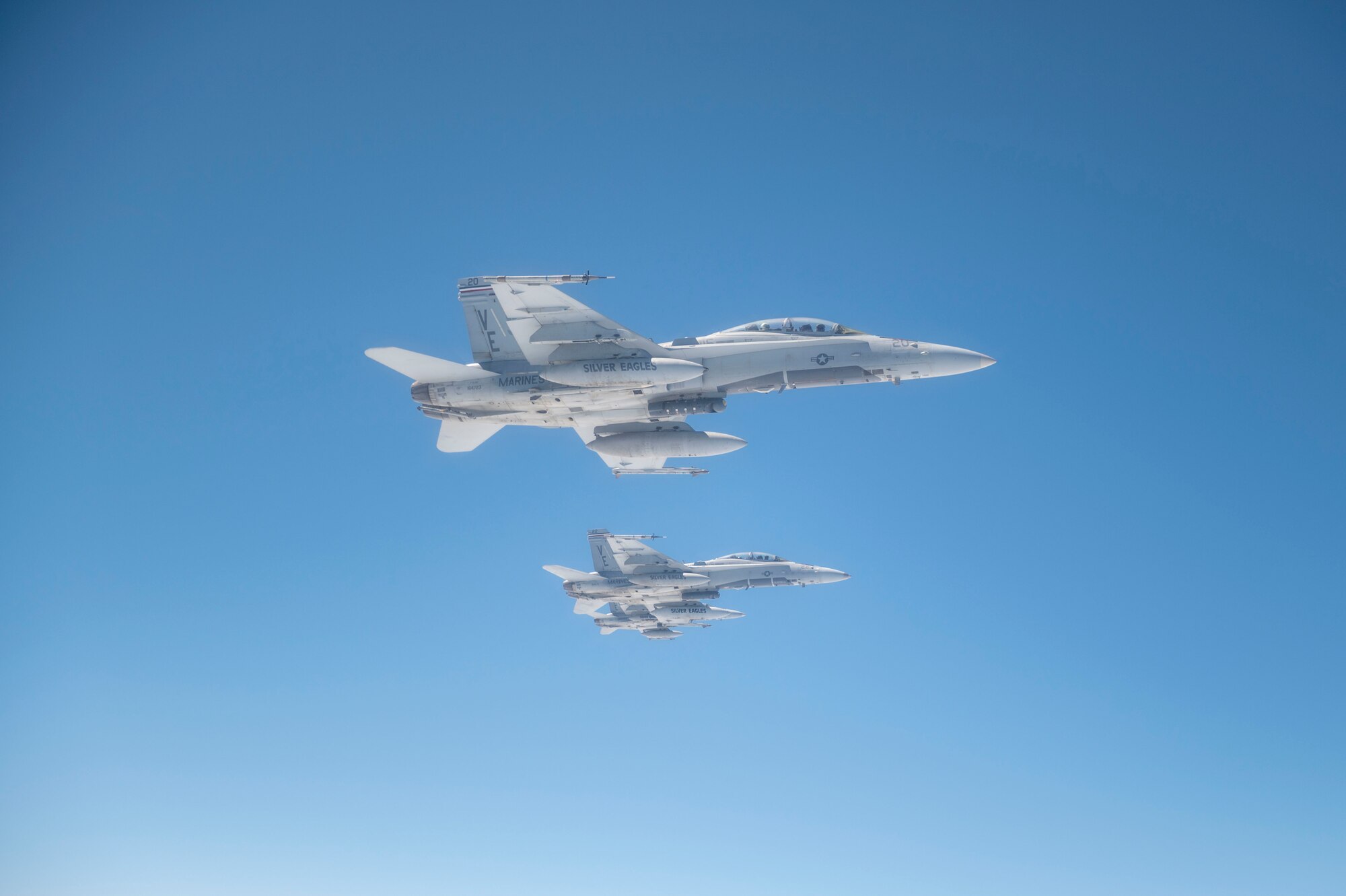 F/A-18s assigned to Marine Fighter Attack Squadron 115 “Silver Eagles” from Marine Corps Air Station Beaufort, South Carolina, fly in formation during an aerial refueling operation off the coast of North Carolina following Exercise Razor Talon May 19, 2022. Razor Talon is the premiere training initiative that offers joint integration opportunities for the Marine Corps, Air Force, Navy, Army and Coast Guard. (U.S. Air Force photo by Senior Airman Kevin Holloway)