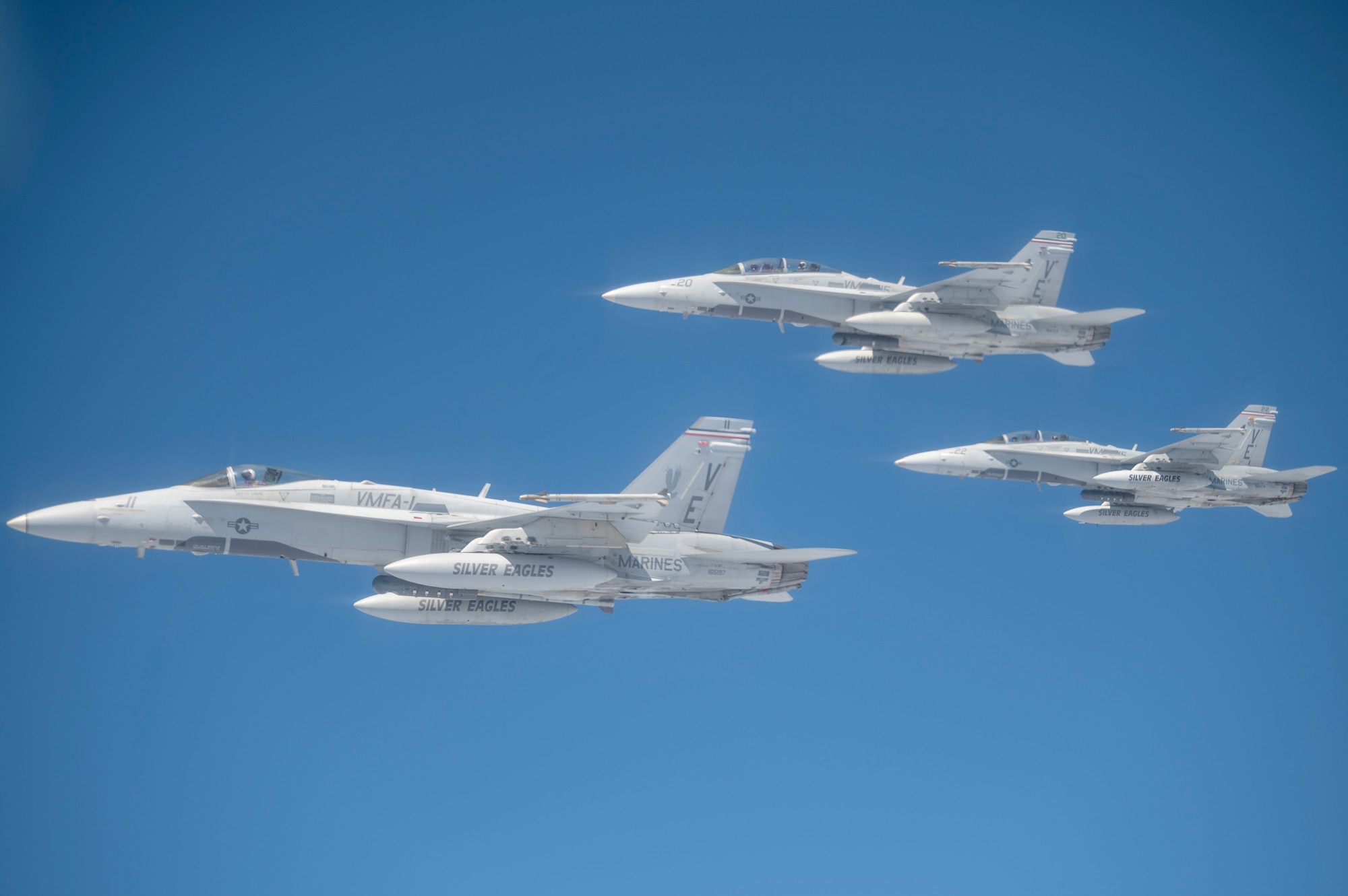 F/A-18s assigned to Marine Fighter Attack Squadron 115 “Silver Eagles” from Marine Corps Air Station Beaufort, South Carolina, fly in formation during an aerial refueling operation off the coast of North Carolina following Exercise Razor Talon May 19, 2022. The Silver Eagles were aerial refueled on their way back to Marine Corps Air Station Beaufort. (U.S. Air Force photo by Senior Airman Kevin Holloway)