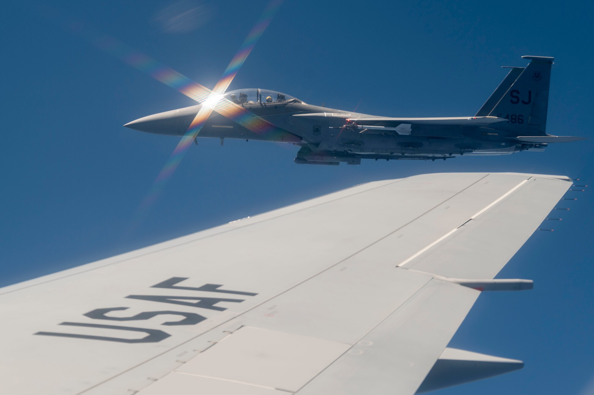 An F-15E Strike Eagle assigned to the 4th Fighter Wing flies alongside a KC-46A Pegasus assigned to the 916th Air Refueling Wing during an aerial refueling operation off the coast of North Carolina following Exercise Razor Talon May 19, 2022. Razor Talon is a large force exercise that takes place on the East Coast of the United States. (U.S. Air Force photo by Senior Airman Kevin Holloway)