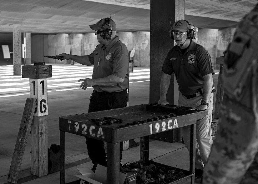 633d Security Forces Squadron training supervisors pass out Beretta M9 pistols to the participants of the Excellence in Competition tournament at Joint Base Langley-Eustis, Virginia, May 19, 2022.
