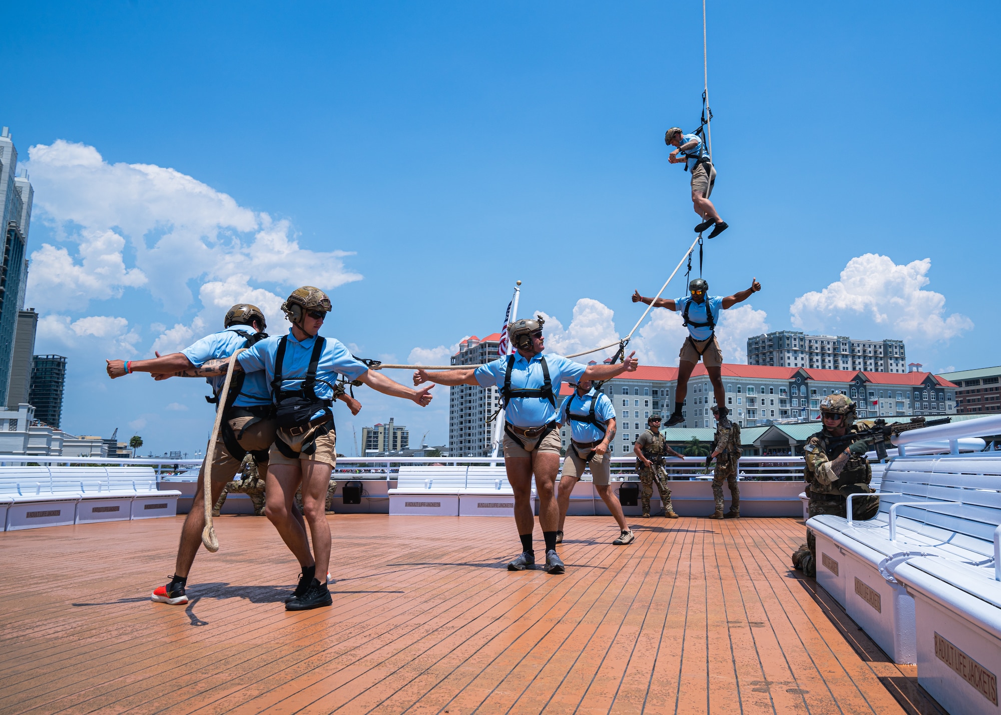 Members are rappelled up to a helicopter during a Special Operations Forces demonstration in Downtown Tampa, Florida, May 18, 2022.