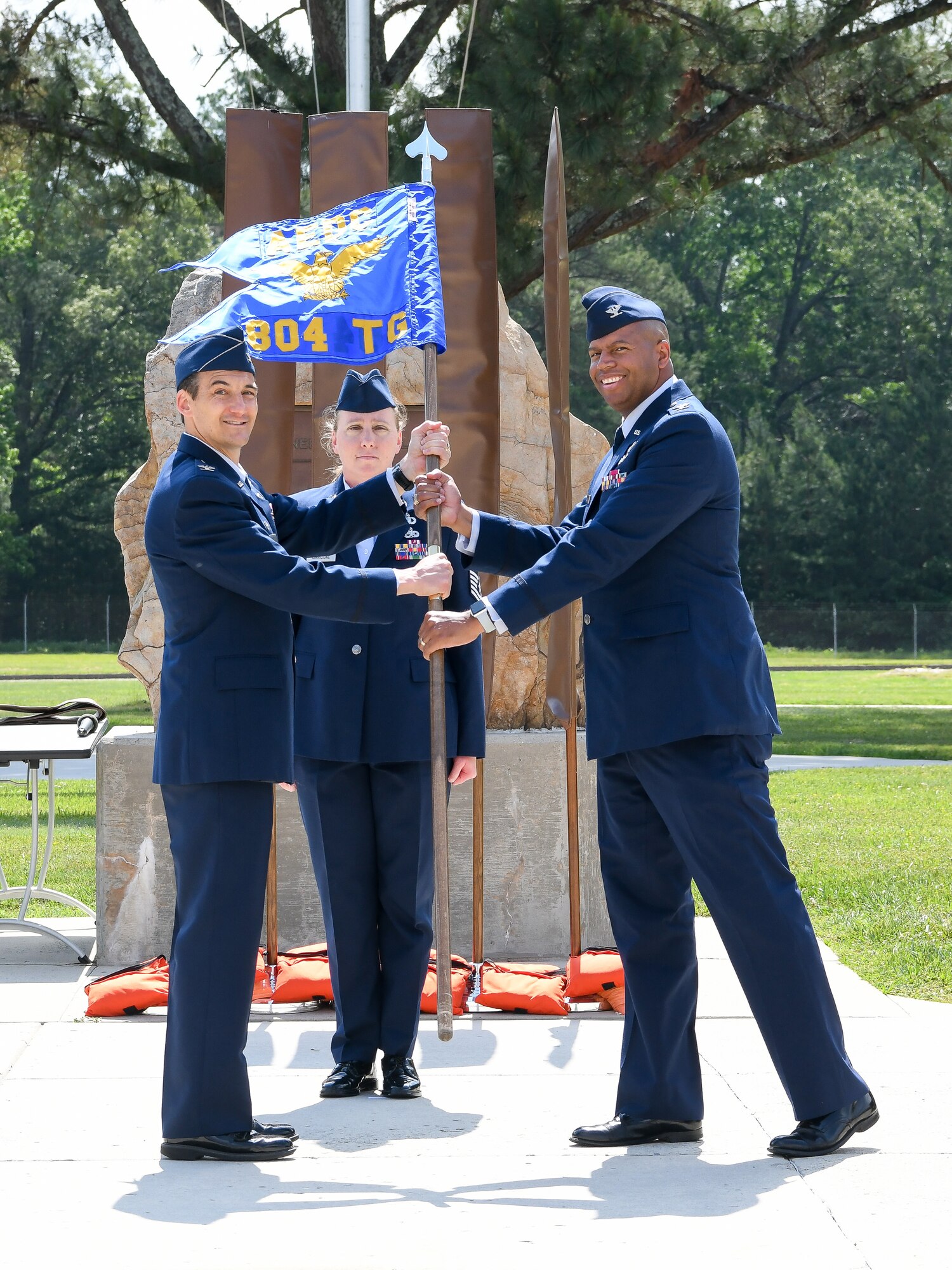 Col. Jeffrey Geraghty, left, AEDC commander, passes the guidon of the newly-activated 804th Test Group to Col. Lincoln Bonner as Bonner assumes command of the 804 TG during an activation ceremony May 20, 2022, at Arnold Air Force Base, Tenn.