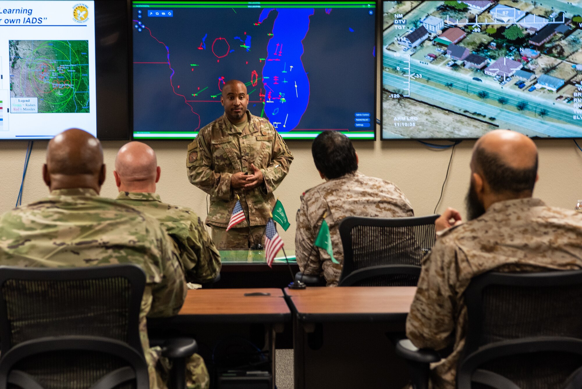 Members of the Royal Saudi Air Forces receive a brief from U.S. Air Force Master Sgt. Earl Richards, 313th Training Squadron flight chief, at Goodfellow Air Force Base, May 18, 2022. Members of the RSAF visited Goodfellow AFB to learn about the joint and coalition forces intelligence, surveillance, and reconnaissance training provided by the 17th Training Wing. (U.S. Air Force Photo by Senior Airman Michael Bowman)