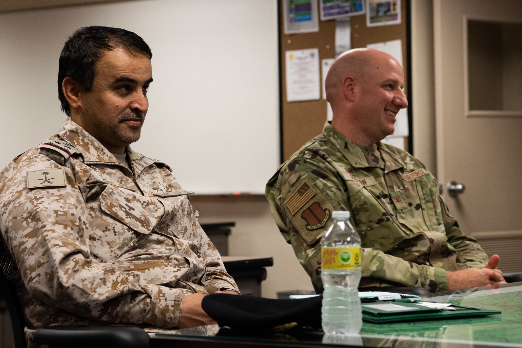 Royal Saudi Air Forces Commodore Al Mutairi Sattam Thaib, Armed Forces Intel and Security Institute commander, and U.S. Air Force Col. Matthew Reilman, 17th Training Wing commander, receive a briefing on international officer training at Goodfellow Air Force Base, May 18, 2022. Members of the RSAF visited Goodfellow AFB to learn about the joint and coalition forces intelligence, surveillance, and reconnaissance training provided by the 17th TRW.  (U.S. Air Force Photo by Senior Airman Michael Bowman)