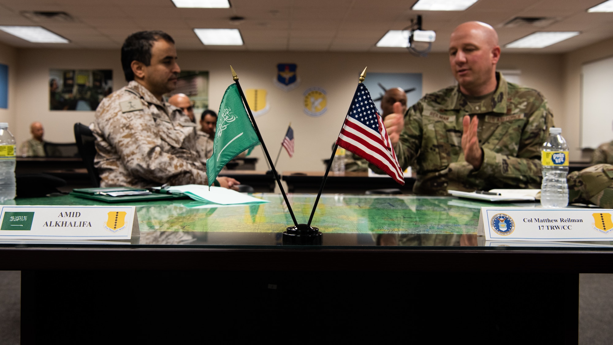Royal Saudi Air Forces Commodore Al Mutairi Sattam Thaib, Armed Forces Intel and Security Institute commander, speaks with U.S. Air Force Col. Matthew Reilman, 17th Training Wing commander, during a brief at Goodfellow Air Force Base, May 18, 2022. Members of the RSAF visited Goodfellow AFB to learn about the joint and coalition forces intelligence, surveillance, and reconnaissance training provided by the 17th TRW.  (U.S. Air Force Photo by Senior Airman Michael Bowman)