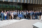 Airmen with the Department of the Air Force-Massachusetts Institute of Technology Artificial Intelligence Accelerator and Defense Department senior leaders gather for a group photo at MIT.