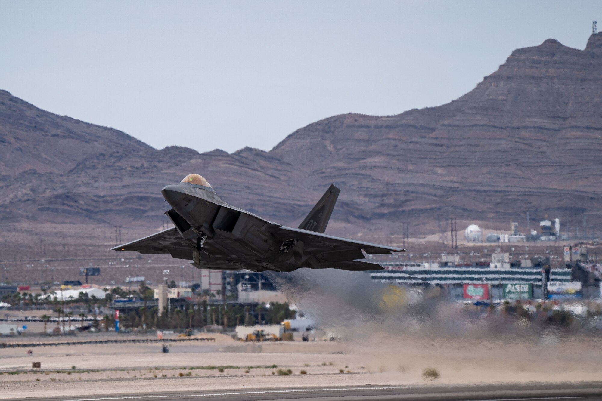 An F-22 Raptor assigned to the 422nd Test and Evaluation Squadron takes off during Black Flag 22-1 at Nellis Air Force Base, Nevada, May 10, 2022. Black Flag 22-1 is focused on developing and validating large force tactics and integration required to deliver combat capability and tactical advantage for the Combat Air Force. (U.S. Air Force photo by Airman 1st Class Josey Blades)