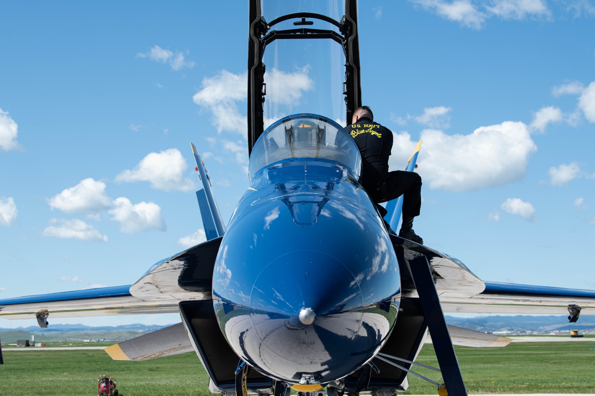 A pilot from the U.S. Navy Flight Demonstration Squadron, the Blue Angels, prepares an F/A-18 Super Hornet for flight during the 2022 Ellsworth Air and Space Show at Ellsworth Air Force Base, S.D., May 13, 2022. The two-day event provided the local community a rare chance to see modern and historic aircraft up close and meet Ellsworth Air Force Base Airmen. (U.S. Air Force photo by Senior Airman Quentin Marx)
