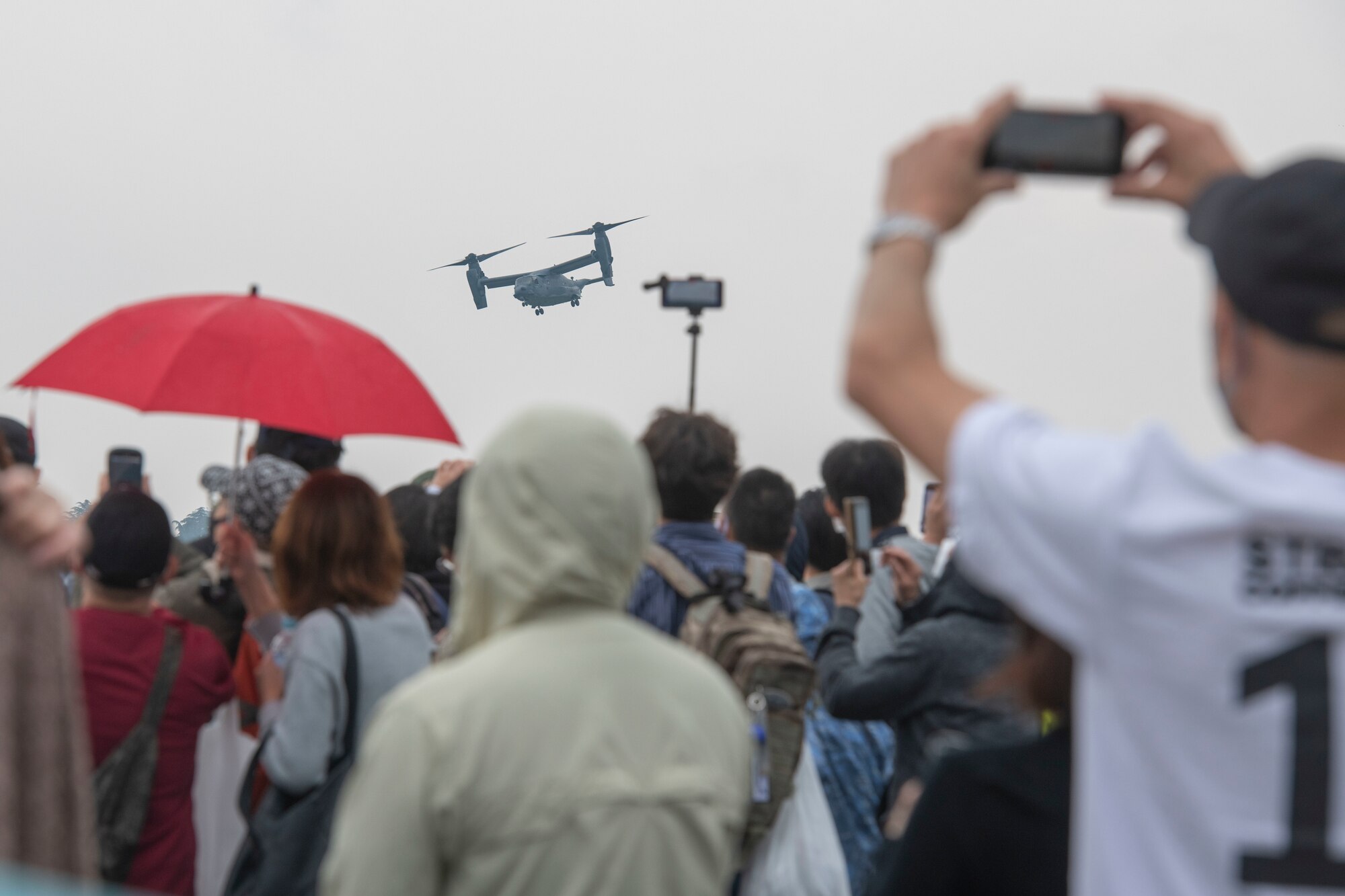 Attendees watch the demonstration of CV-22 Osprey capabilities exercise during Friendship Festival 2022, at Yokota Air Base, Japan, May 21. The demonstration was one of many events during the weekend that showcased U.S. military capabilities. (U.S. Air Force photo by Machiko Arita)