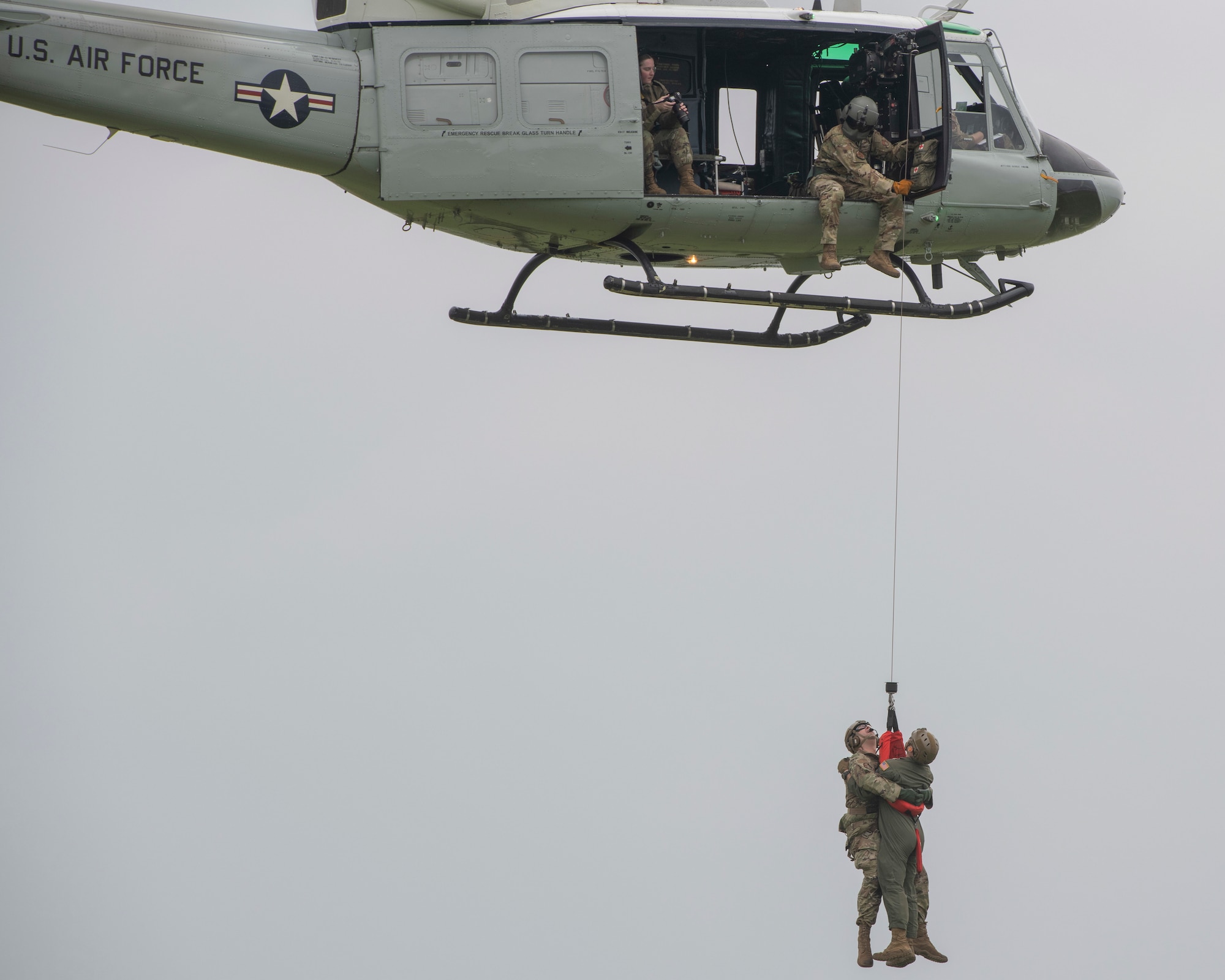 UH-1N Iroquois demonstration team practices rescue during Friendship Festival 2022, at Yokota Air Base, Japan, May 21. The demonstration was one of many events during the weekend that showcased U.S. military capabilities. (U.S. Air Force photo by Machiko Arita)
