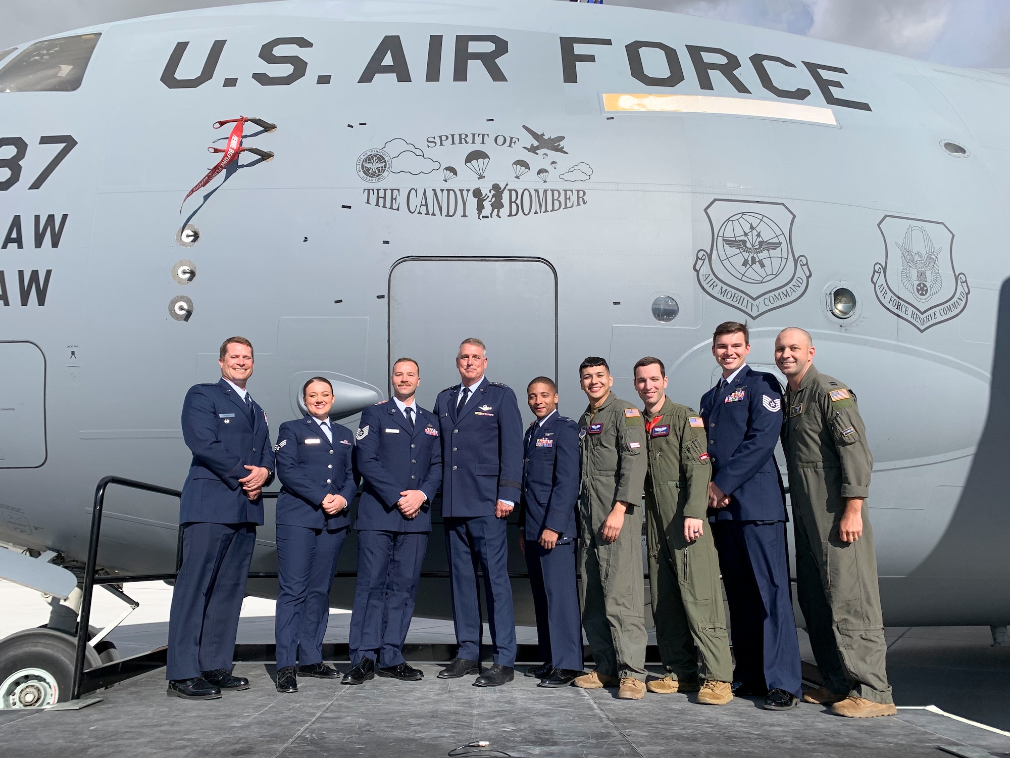 U.S. Air Force Gen Mike Minihan, Air Mobility Command commander, stand with the crew of the C-17 Globemaster III  that was renamed to "Spirit of the Candy Bomber" in Provo, Utah, May 20, 2022.