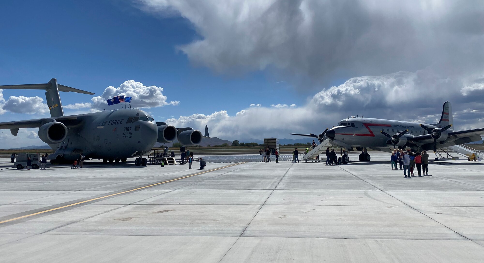 A C-54 Skymaster and a C-17 Globemaster III sit beside each other in Provo, Utah, May 20, 2022.