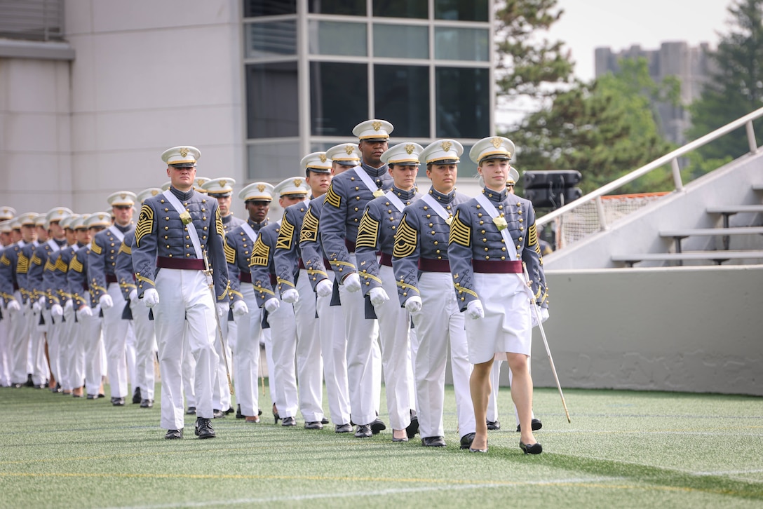 A group of cadets walk in formation.