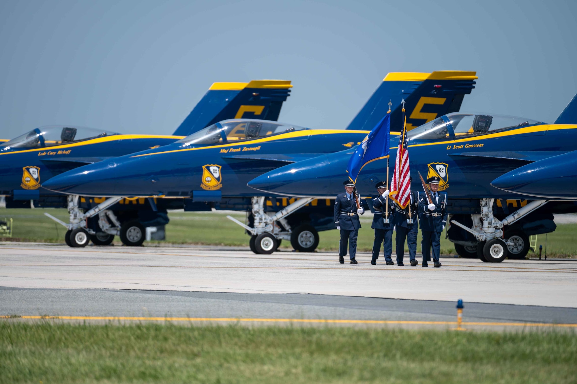 Dover Air Force Base Honor Guard members present the colors in front of the U.S. Navy Flight Demonstration Squadron, the Blue Angels, F/A-18 Super Hornets, during the first day’s opening ceremony of the 2022 Thunder Over Dover Airshow, May 21, 2022, at Dover Air Force Base, Delaware. This was the first time the Blue Angels performed at Dover AFB since 1991. (U.S. Air Force photo by Senior Airman Faith Schaefer)