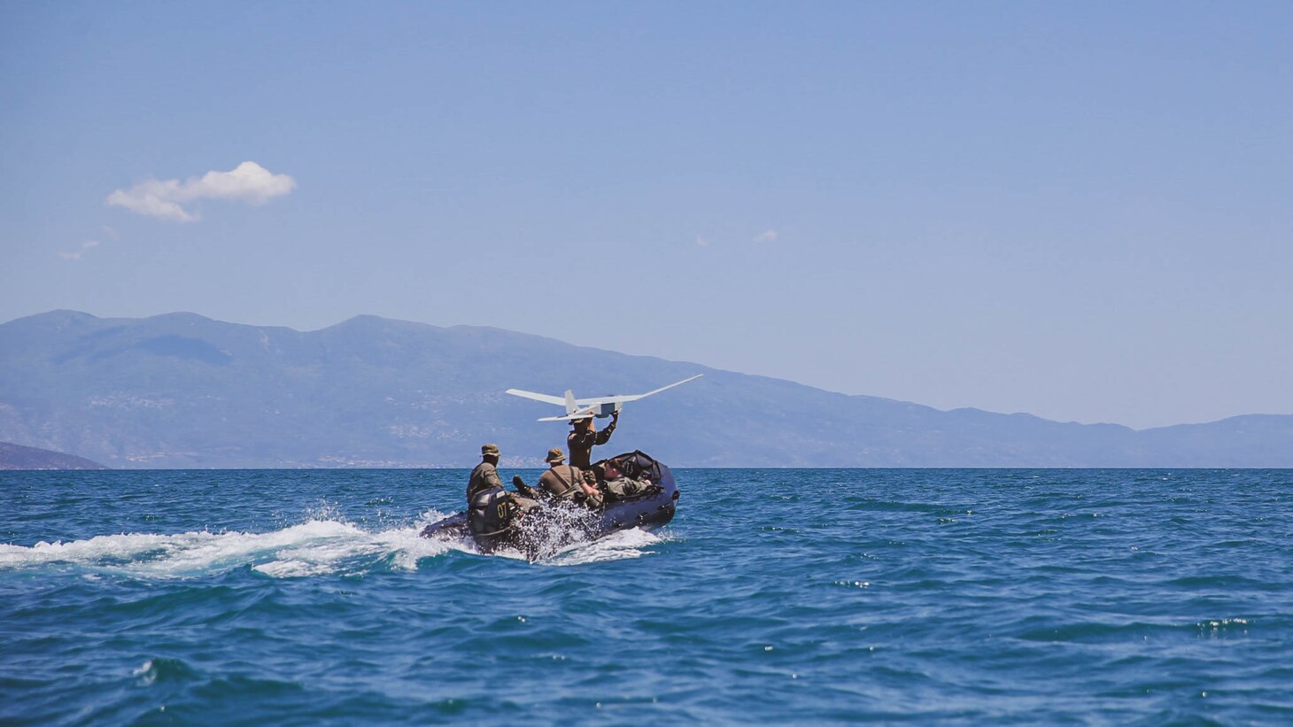 U.S. Marine Corps Cpl. Julian Hinojosa from Brownsville, Texas, assigned to Task Force 61/2, launches a RQ-20 Puma to show Hellenic Special Forces about the capabilities of the RQ-20 Puma during exercise Alexander the Great 22, Greece, May 11, 2022. Alexander the Great 22 strengthens interoperability and force readiness between the U.S., Greece, and Allied nations, enhancing strategic defense and partnership while promoting security and stability in the region. (U.S. Marine Corps photo by Lance Cpl. Emma Gray)