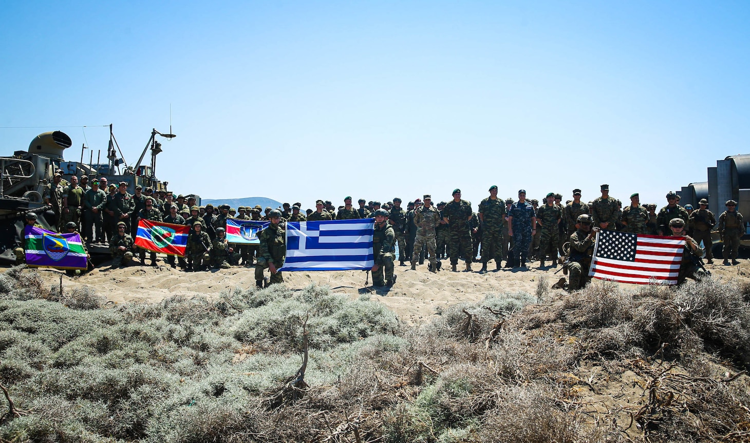 U.S. Marines assigned to Task Force 61/2, and Hellenic Marines with the 32nd Hellenic Marine Brigade pose for a photo during exercise Alexander the Great 22, Greece, May 17, 2022. Alexander the Great 22 strengthens interoperability and force readiness between the U.S., Greece, and Allied nations, enhancing strategic defense and partnership while promoting security and stability in the region. (U.S. Marine Corps photo by Lance Cpl. Ethan Robert Jones)