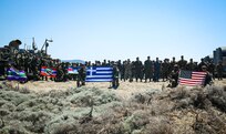 U.S. Marines assigned to Task Force 61/2, and Hellenic Marines with the 32nd Hellenic Marine Brigade pose for a photo during exercise Alexander the Great 22, Greece, May 17, 2022. Alexander the Great 22 strengthens interoperability and force readiness between the U.S., Greece, and Allied nations, enhancing strategic defense and partnership while promoting security and stability in the region. (U.S. Marine Corps photo by Lance Cpl. Ethan Robert Jones)