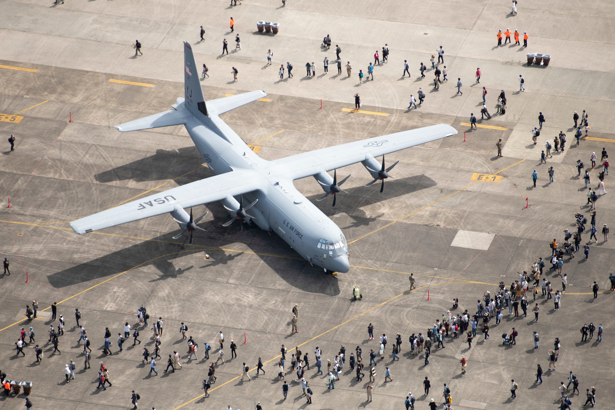 Festival guests begin to crowd around a C-130J Super Hercules belonging to the 36th Airlift Squadron during the opening of Friendship Festival 2022, at Yokota Air Base, Japan, May 22, 2022. The two-day festival was an opportunity for visitors to learn more about the U.S. and Japan bilateral partnership, while strengthening the bonds between Yokota and the local communities. Yokota was able to host the event with the support of Japanese Self-Defense Force, sister services and the local community. (U.S. Air Force photo by Staff Sgt. Ryan Lackey)