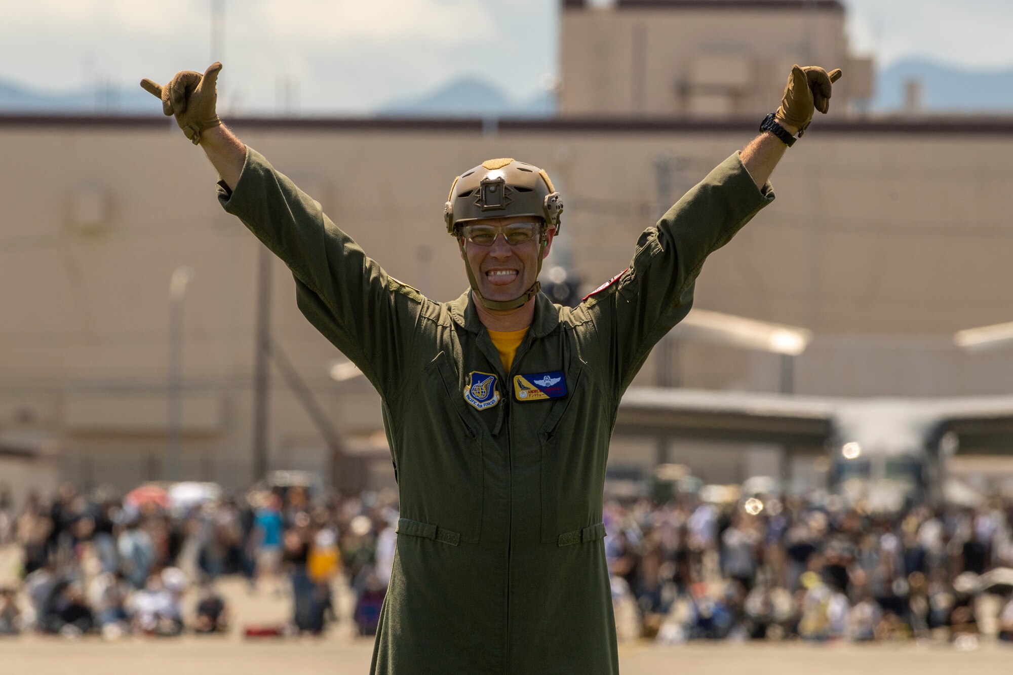 Col. Andrew Campbell, 374th Airlift Wing commander, poses for a photo while waiting to participate in a UH-1 rescue demonstration during the Friendship Festival 2022, at Yokota Air Base, Japan, May 22, 2022. The two-day festival was an opportunity for visitors to learn more about the U.S. and Japan bilateral partnership, while strengthening the bonds between Yokota and the local communities. Yokota was able to host the event with the support of Japanese Self-Defense Force, sister services and the local community. (U.S. Air Force photo by Staff Sgt. Ryan Lackey)