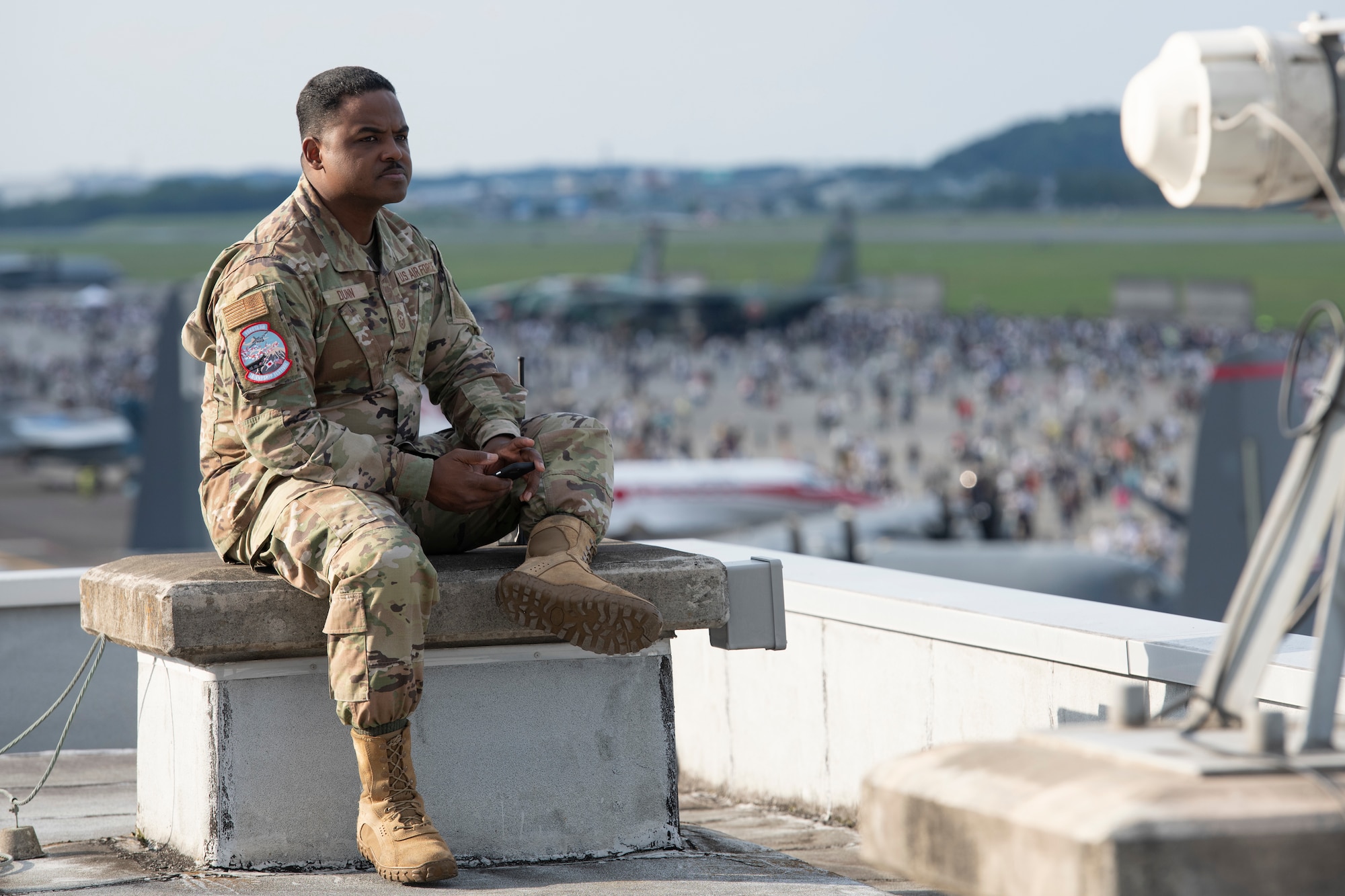 Chief Master Sgt. Jerry Dunn, 374th Airlift Wing command chief, watches the crowd during Friendship Festival 2022, at Yokota Air Base, Japan, May 22. The two-day festival was an opportunity for visitors to learn more about the U.S. and Japan bilateral partnership, while strengthening the bonds between Yokota and the local communities. Yokota was able to host the event with the support of Japan Self-Defense Force, sister services and the local community. (U.S. Air Force photo by Tech. Sgt. Joshua Edwards)