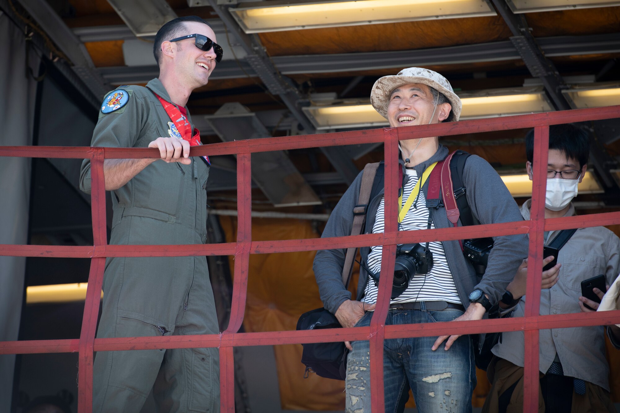 1st Lt. Nathan Tomlin, 9th Air Refueling Squadron KC-10 pilot, talks to an attendee during Friendship Festival 2022, at Yokota Air Base, Japan, May 22. The two-day festival was an opportunity for visitors to learn more about the U.S. and Japan bilateral partnership, while strengthening the bonds between Yokota and the local communities. Yokota was able to host the event with the support of Japan Self-Defense Force, sister services and the local community. (U.S. Air Force photo by Machiko Arita)