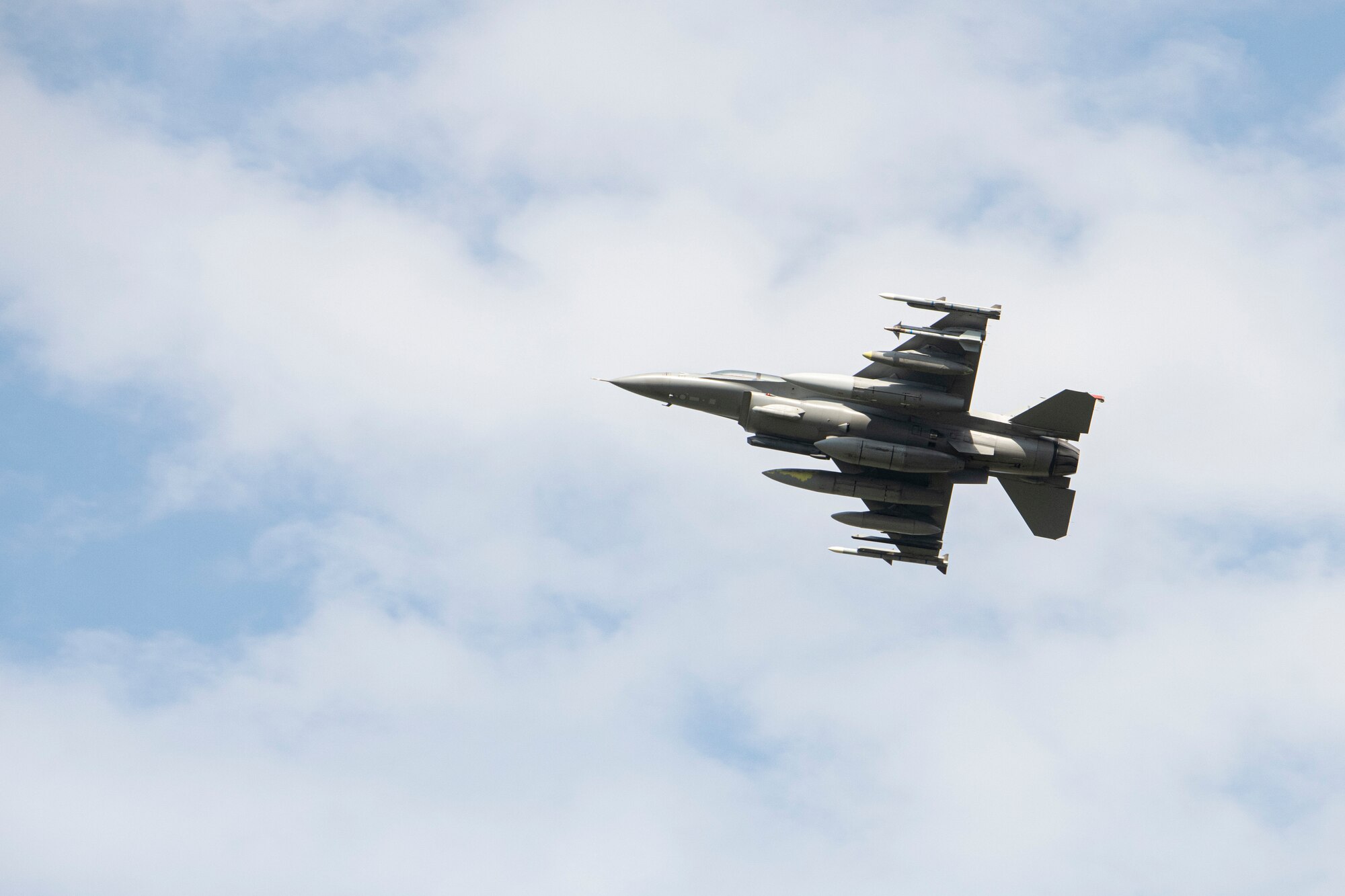 A pilot guides an F-16 Fighting Falcon through an aerial demonstration during Friendship Festival 2022, at Yokota Air Base, Japan, May 22. The demonstration was one of many events during the weekend that showcased U.S. military capabilities. (U.S. Air Force photo by Machiko Arita)