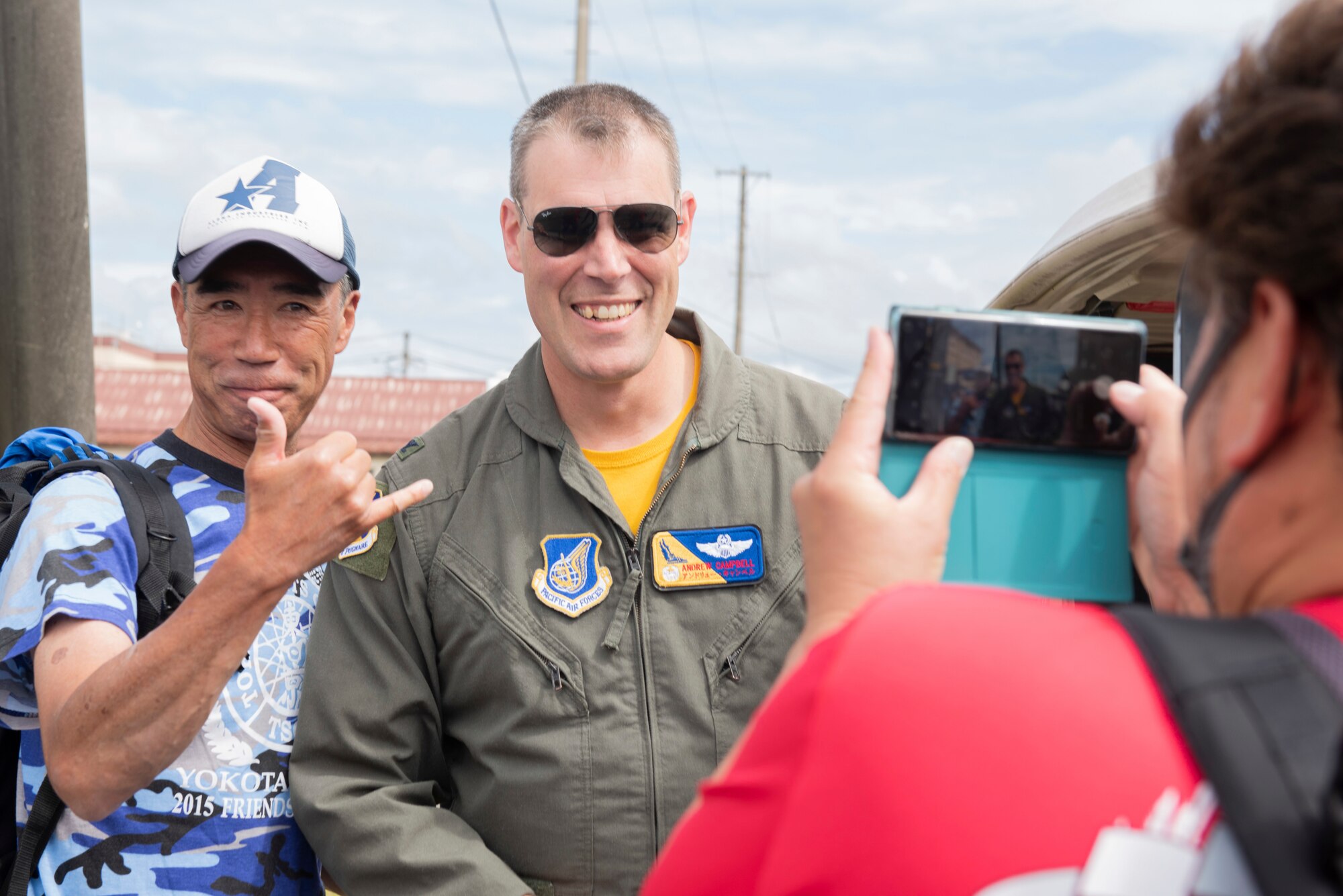 Col. Andrew Campbell, 374th Airlift Wing commander, poses for a photo with an attendee during Friendship Festival 2022, at Yokota Air Base, Japan, May 22. The two-day festival was an opportunity for visitors to learn more about the U.S. and Japan bilateral partnership, while strengthening the bonds between Yokota and the local communities. Yokota was able to host the event with the support of Japan Self-Defense Force, sister services and the local community. (U.S. Air Force photo by Machiko Arita)