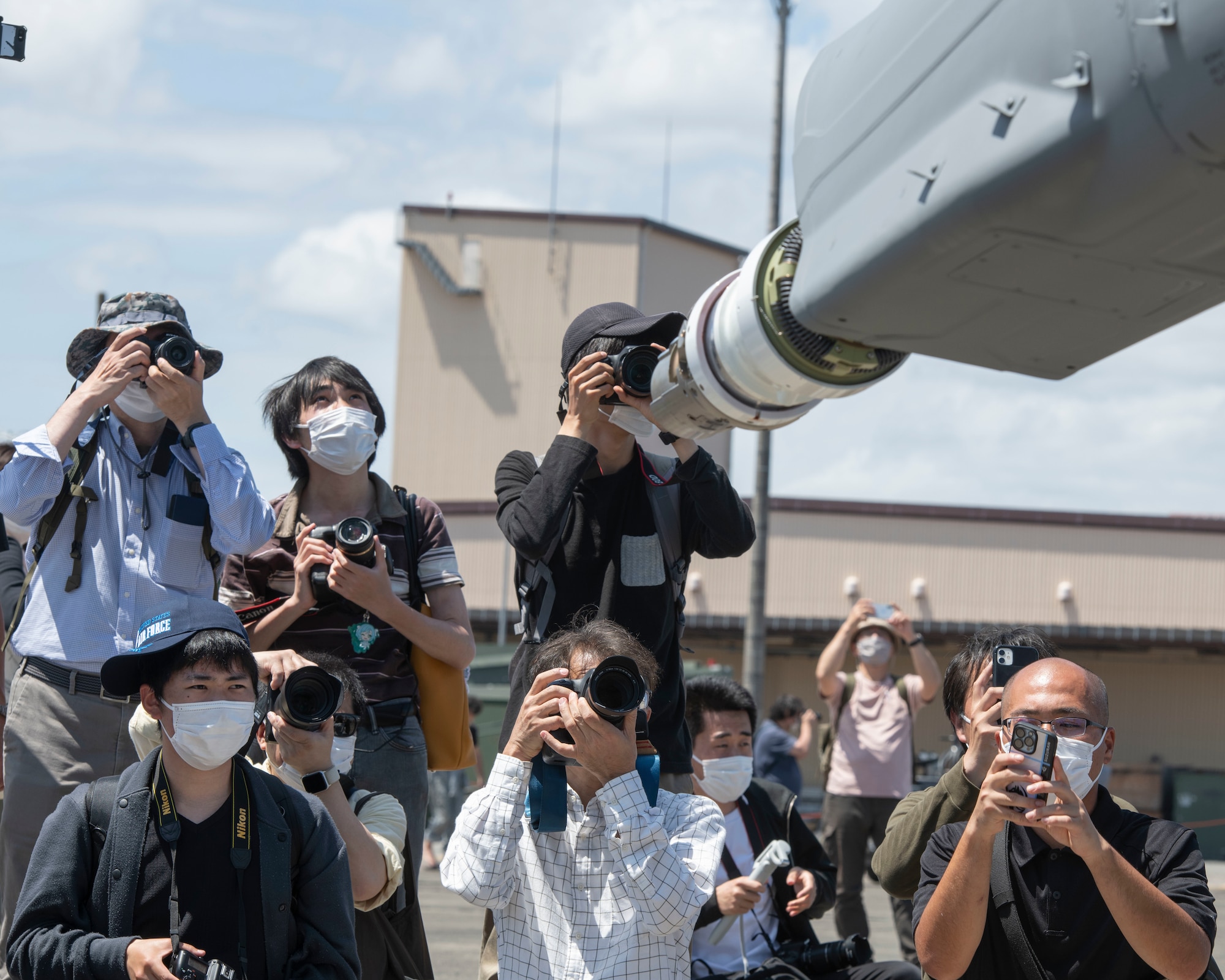 Attendees take photos of a mid-air refueling boom of a KC-10 Extender assigned to 9th Air Refueling Squadron from Travis Air Force Base, California, during Friendship Festival 2022, at Yokota Air Base, Japan, May 22. The two-day festival was an opportunity for visitors to learn more about the U.S. and Japan bilateral partnership, while strengthening the bonds between Yokota and the local communities. Yokota was able to host the event with the support of Japan Self-Defense Force, sister services and the local community. (U.S. Air Force photo by Machiko Arita)