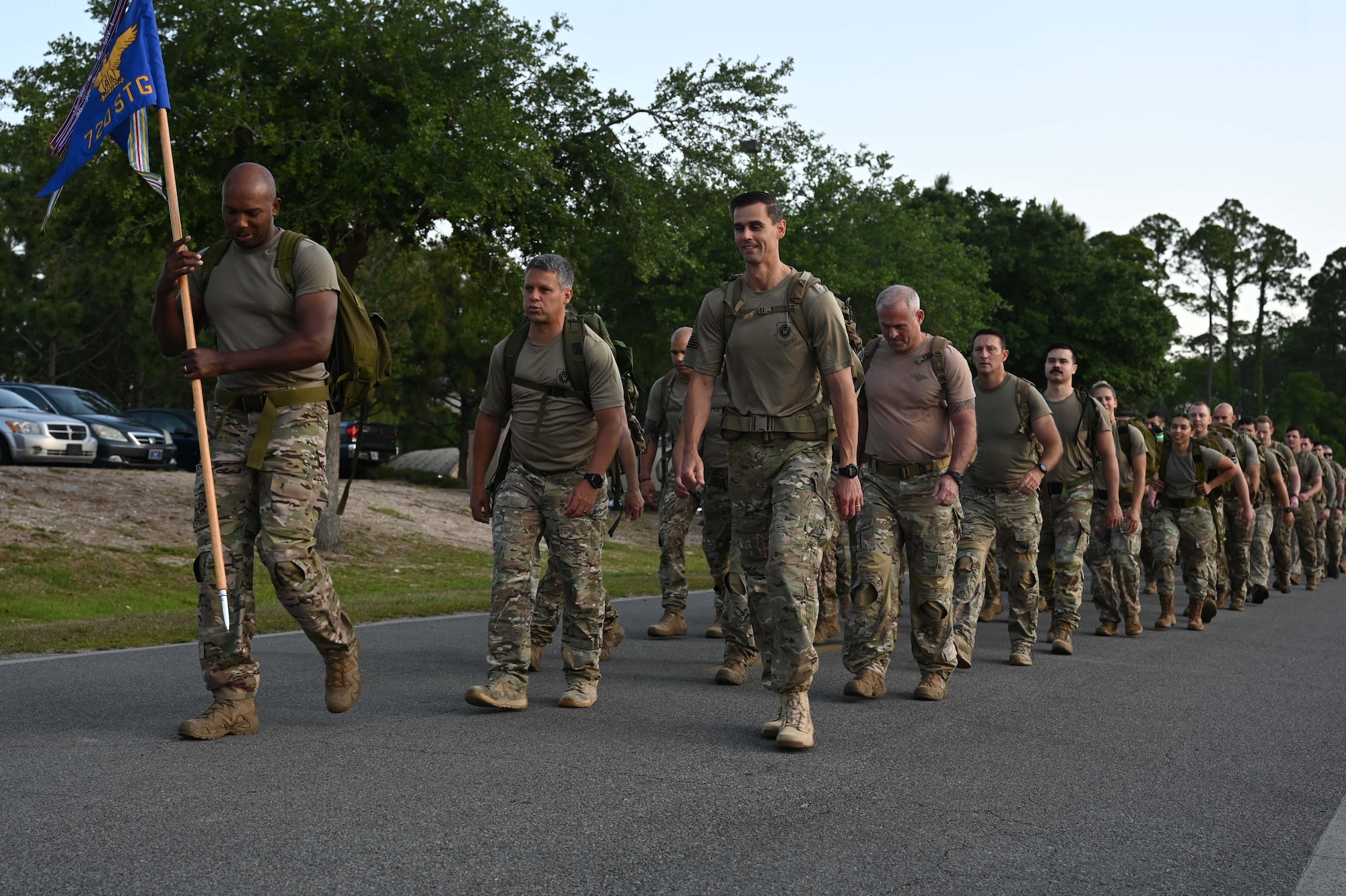 Members of the 24th Special Operations Wing begin their ruck march during the 2022 Run to Honor 5K Run/Ruck at Hurlburt Field, Florida May 13, 2022. Air Force Special Operations Command has lost 380 members, both active duty and civilian, since the creation of the command, and this event is a tribute to AFSOC Airmen who have made the ultimate sacrifice in service to their country. (U.S. Air Force photo by Staff Sgt. Brandon Esau)