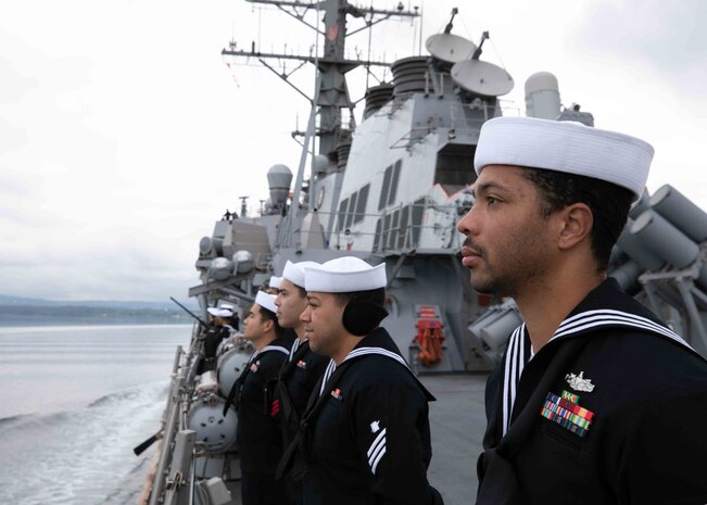 Yeoman 2nd Class Jeremiah Alisea mans the rails aboard the Arleigh Burke-class guided-missile destroyer USS Porter (DDG 78), as the ship prepares to pull into Oslo, Norway, for a scheduled port visit May 22, 2022. Porter is on a scheduled deployment in the U.S. Naval Forces Europe area of operations, employed by U.S. Sixth Fleet to defend U.S., Allied and Partner interests.