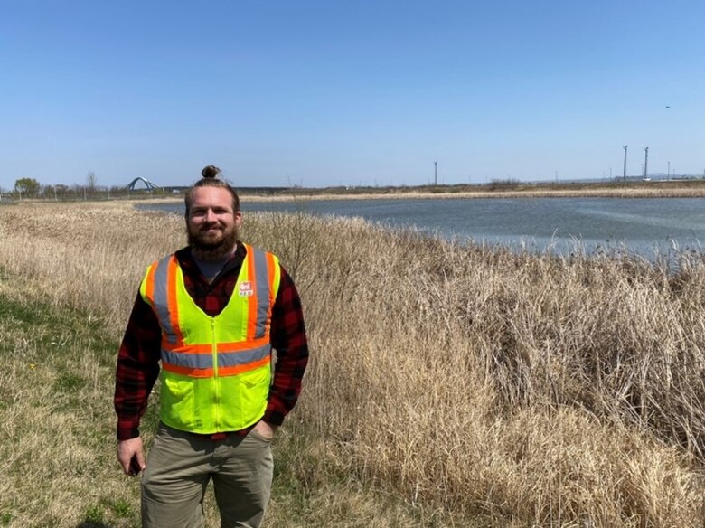 Daniel Novotny stands near detention ponds on USAG Humphreys near the Anseong river in Pyeongtaek, South Korea, April 13. The detention ponds have become popular areas for various species feeding or resting around USAG Humphreys. (Courtesy photo)