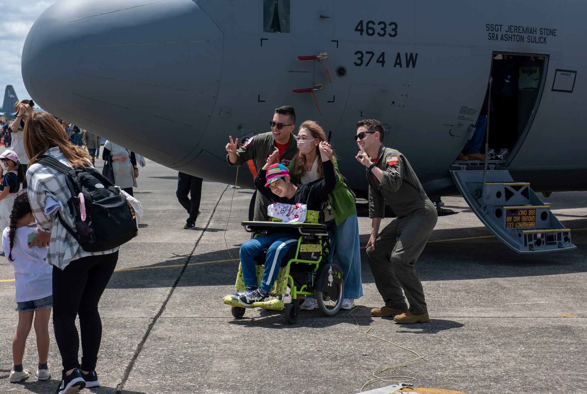 Pilots assigned to the 36th Airlift Squadron pose for a photo during Friendship Festival 2022, at Yokota Air Base, Japan May 22, 2022. The two-day festival was an opportunity for visitors to learn more about the U.S. and Japan bilateral partnership, while strengthening the bonds between Yokota and the local communities. Yokota was able to host the event with the support of Japan Self-Defense Force, sister services and the local community. (U.S. Air Force photo by Senior Airman Hannah Bean)