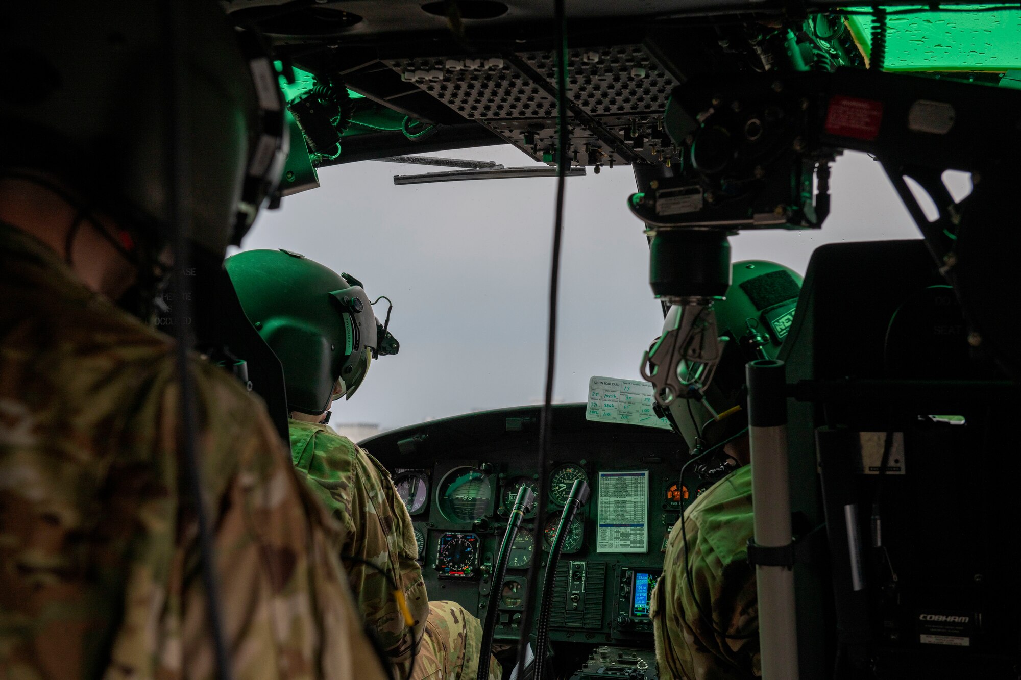 Capt. Jacob Taylor (left), 459th Airlift Squadron pilot, and Maj. David Shadoin (right), 459th AS pilot, look over controls in a UH-1N Iroquois helicopter during Friendship Festival 2022, at Yokota Air Base, Japan May 21, 2022. The two-day festival was an opportunity for visitors to learn more about the U.S. and Japan bilateral partnership, while strengthening the bonds between Yokota and the local communities. Yokota was able to host the event with the support of Japan Self-Defense Force, sister services and the local community. (U.S. Air Force photo by Senior Airman Hannah Bean)