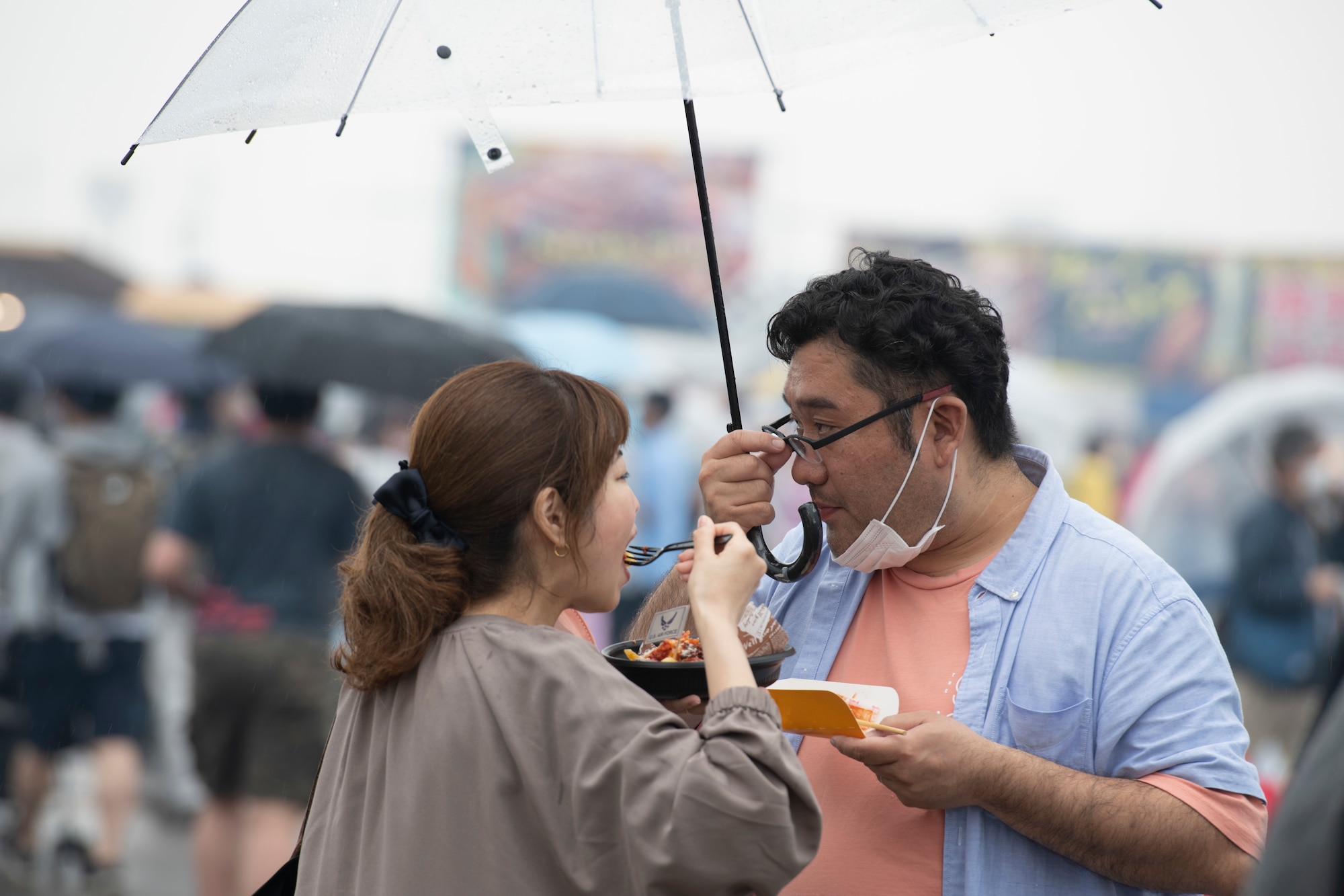 Attendees eat food during Friendship Festival 2022, at Yokota Air Base, Japan, May 21. The two-day festival was an opportunity for visitors to learn more about the U.S. and Japan bilateral partnership, while strengthening the bonds between Yokota and the local communities. Yokota was able to host the event with the support of Japanese Self-Defense Force, sister services and the local community. (U.S. Air Force photo by Tech. Sgt. Joshua Edwards)