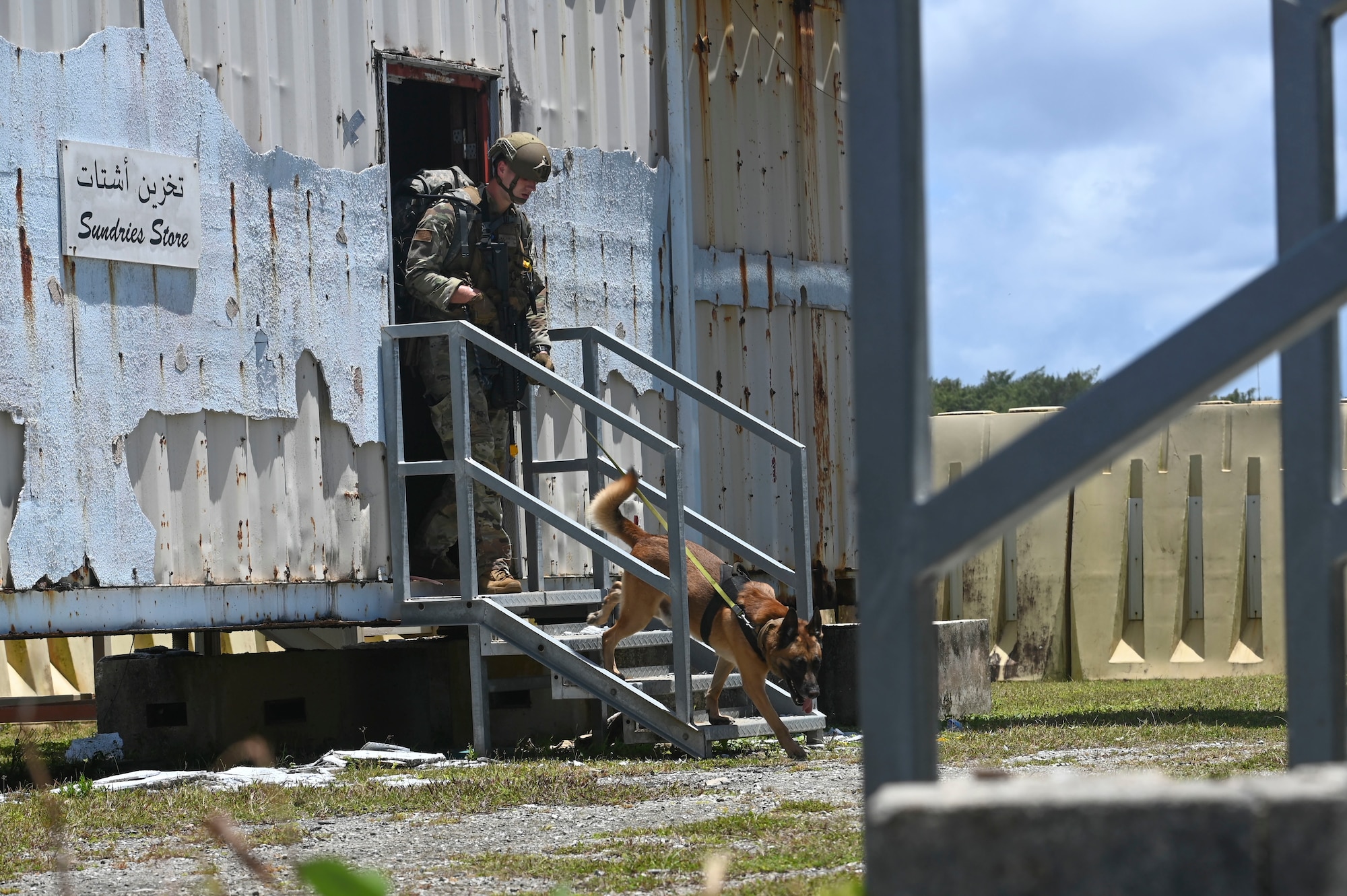 U.S. Air Force Staff Sgt. Tyler Parrish, military working dog handler assigned to the 647th Security Forces Squadron, Joint Base Pearl Harbor-Hickam, Hawaii, and his MWD, Joker, participate in the MWD challenge during the Advanced Combat Skills Assessment at Andersen Air Force Base, Guam, April 17, 2022. ACSA bolsters defender ethos, strengthens esprit-de-corps amongst participants and reinforces the competitive nature within security forces. (U.S. Air Force photo by Airman 1st Class Emily Saxton)