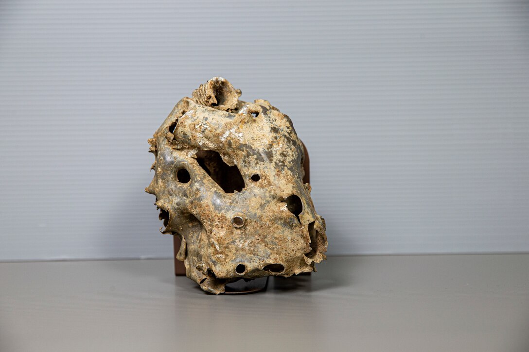 “The reality of war” 
This canteen, with over 30 bullet holes, was worn by a Marine during the Battle of Sugar Loaf Hill.